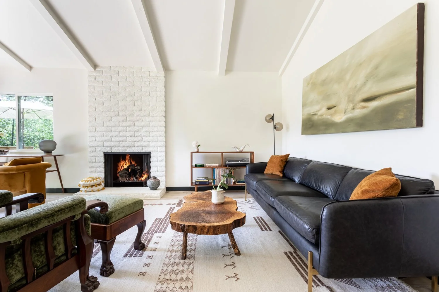 Photo by: Ace Misiunas
This unique wooden coffee table was made by splitting an unmilled log of English walnut into two parts. Its live edge retains the organic form of the tree from which it was made. The entire surface is textured with chisel marks