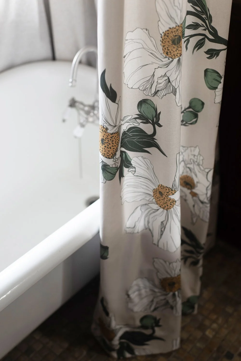 Photo by: Steven Dewall
This bathroom features a combination of salvaged and contemporary materials and reproductions that restore this space within the ethos of craftsman design. This antique bathtub was salvaged from historic properties within the 