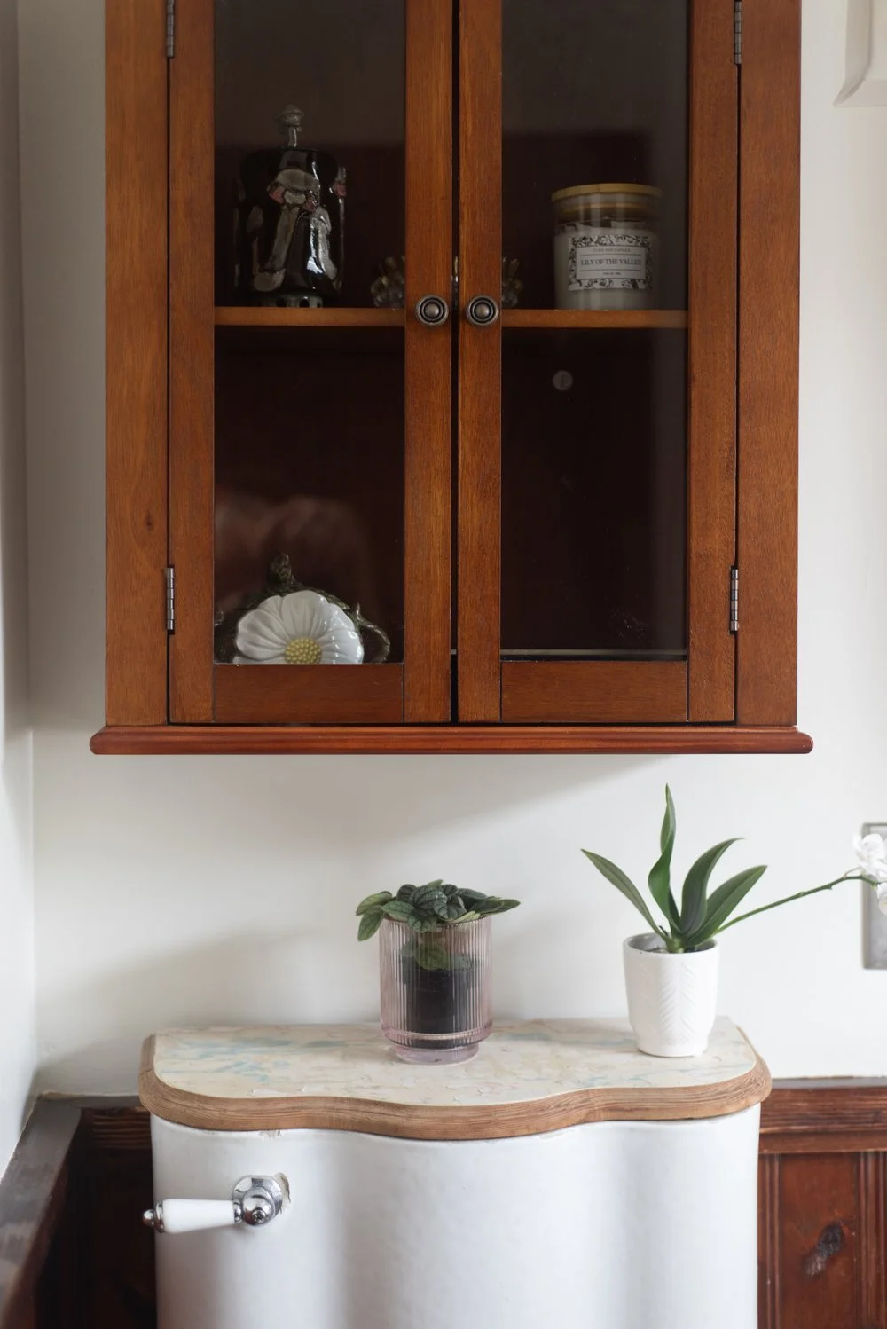 Photo by: Steven Dewall
Wood cabinetry and wainscotting incorporated throughout this bathroom create a connection with nature and celebrate the natural beauty of woodgrain.