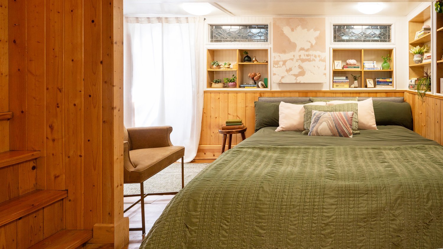 Photo by: Steven Dewall
Two south-facing leaded glass windows and a large window in the door to the outside allow natural light to enter the space.