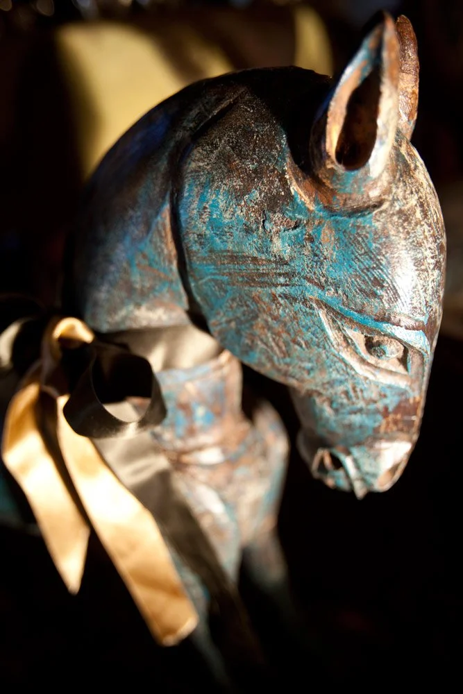 Photo by: Brad Nicol
A vintage wooden pony is tied up with a silk satin ribbon.