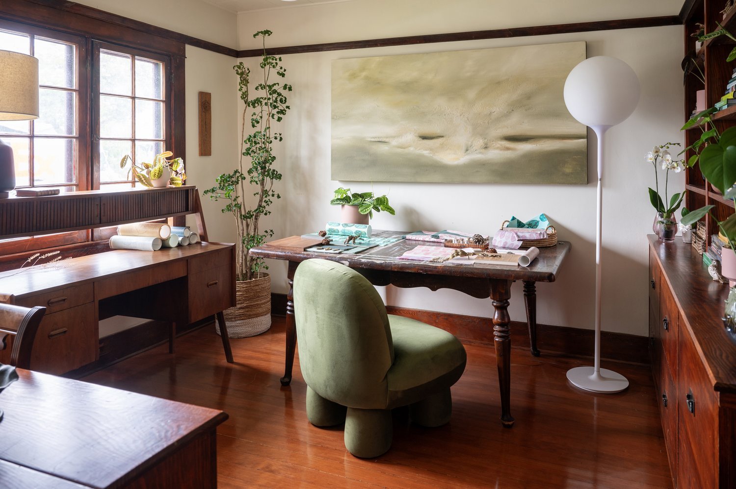 Photo by: Steven Dewall
This home office features a nature-inspired palette of brown and green to create a mindful connection with the tranquility of nature through biophilic design.