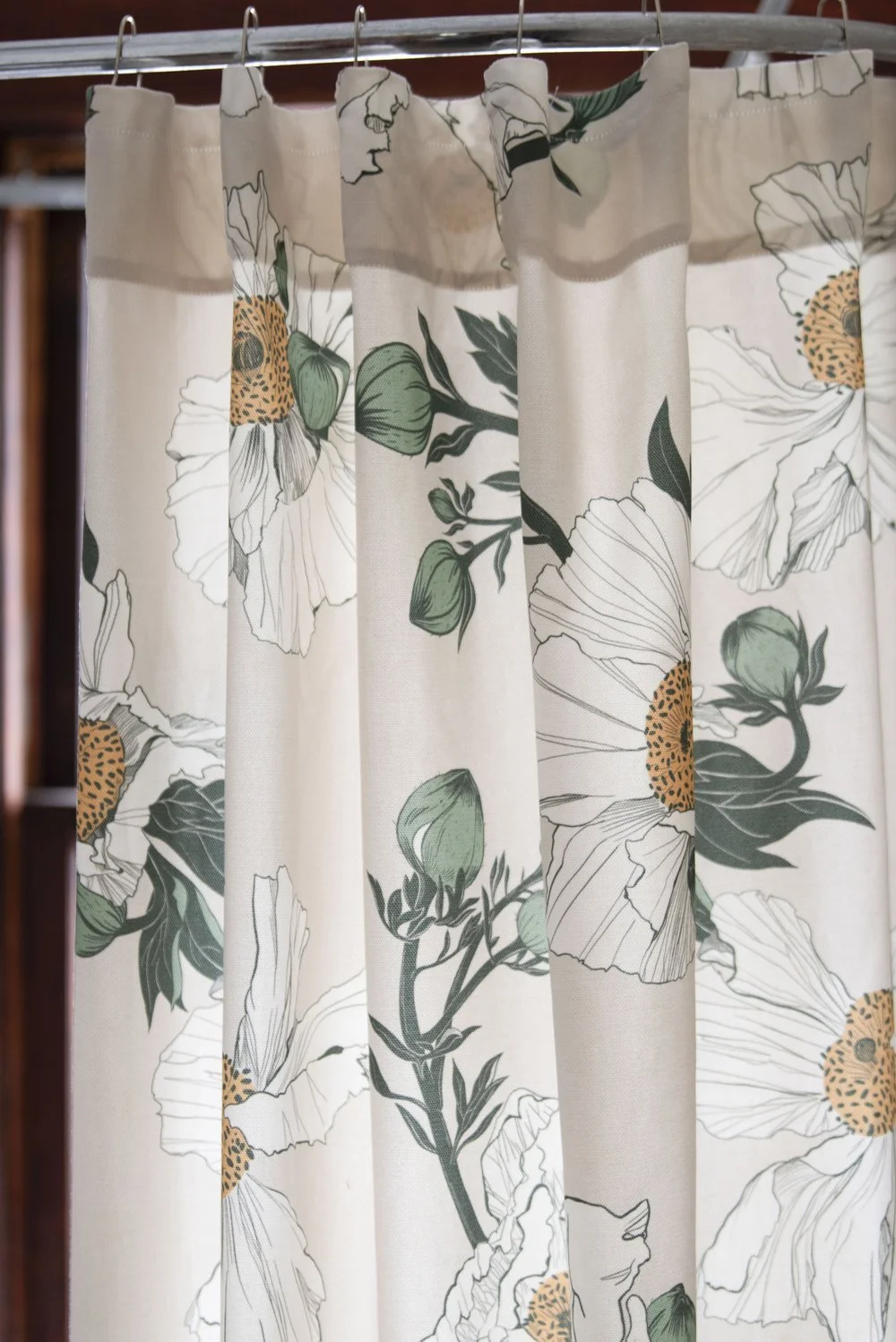 Photo by: Steven Dewall
A shower curtain made from the Kale Tree Matilija Poppy Textile - Natural introduces a timeless botanical print that evokes the joy of this Californian native wildflower.