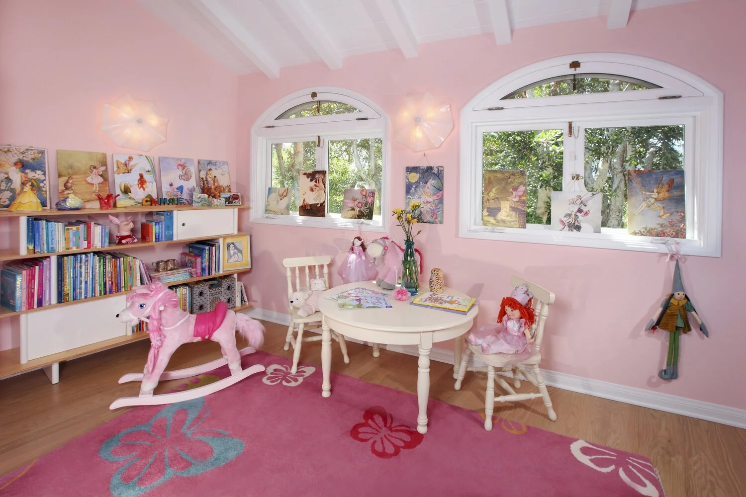 Photo by: Chas Metivier
Hand blown glass light fixtures in a delicate floral pattern add sophistication to this child’s space.