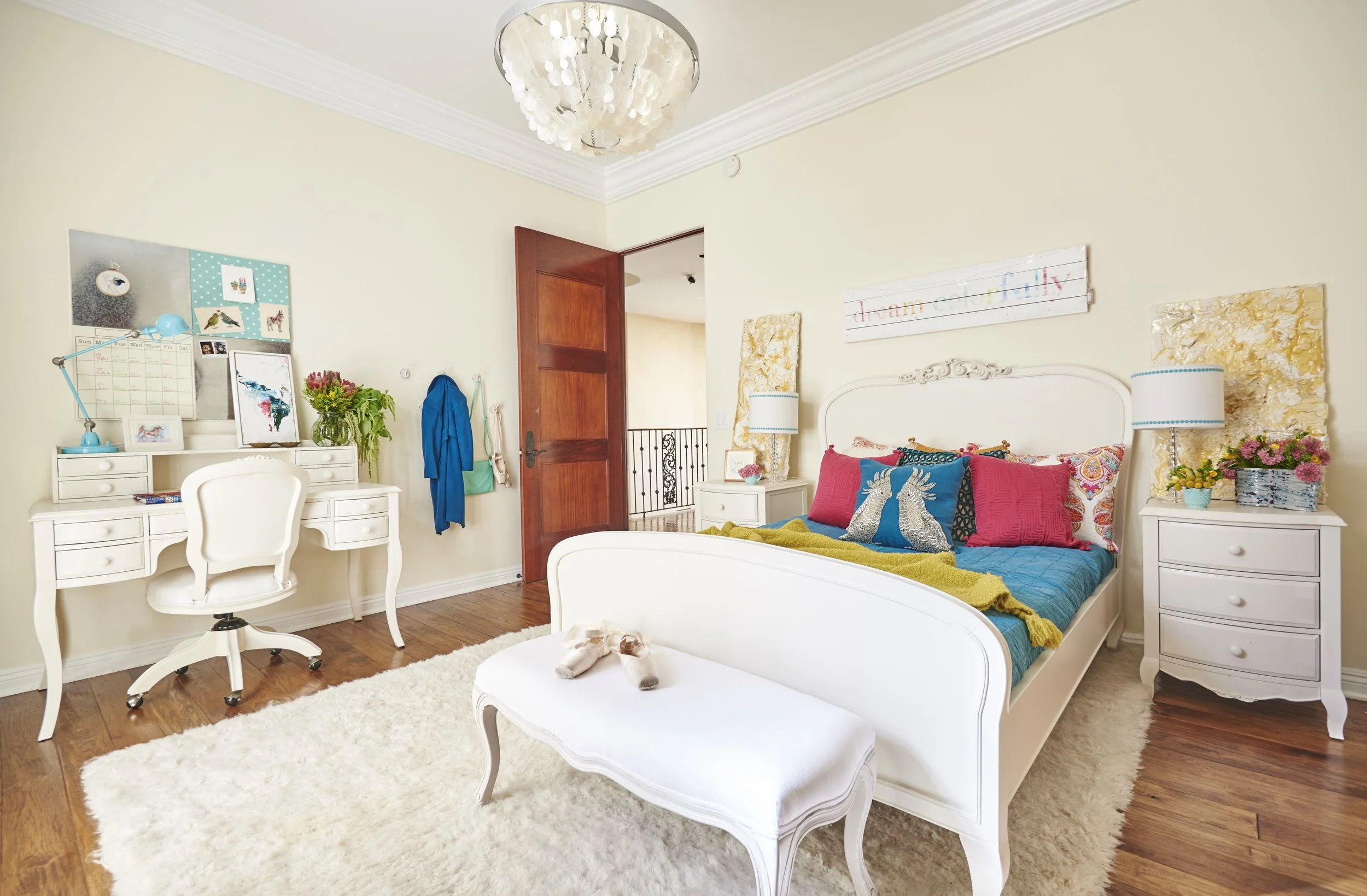 Photo by: Steven Dewall
A teen girl's room was outfitted with colorful elements and antique white furniture inspired by Queen Anne style. 