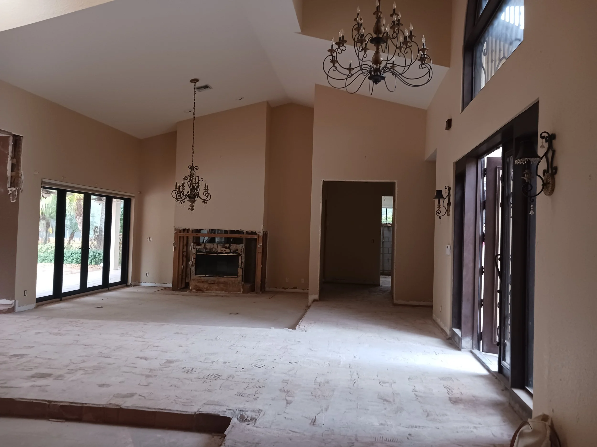 Before-This house was from the 80's and the client bought it to renovated and sell it. The main living-dining room had 2 sunken areas that we agree to level it. The traditional style was reflected in windows, doors, pendants, and the floor.