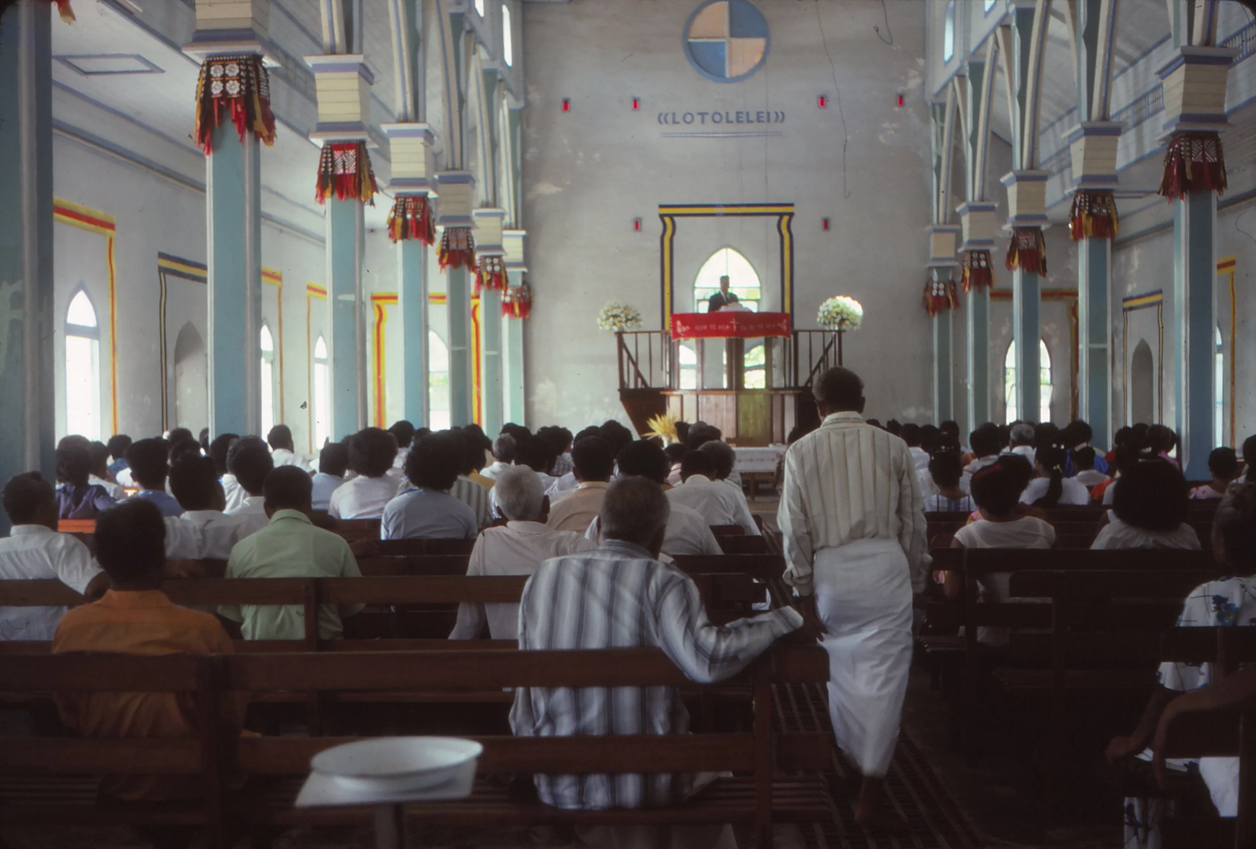 Church service in progress in Nanumea, pastor in elevated pulpit