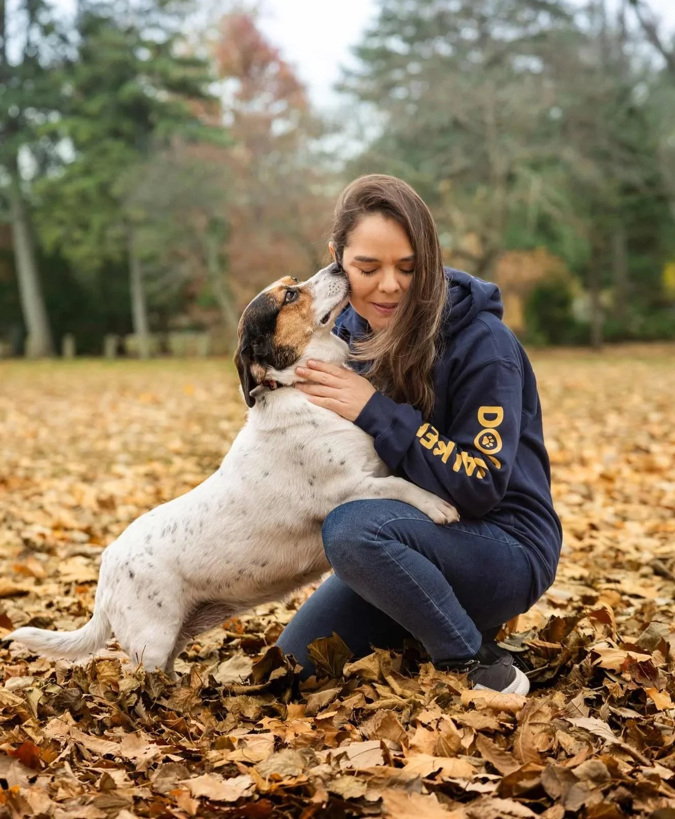 Dog liking dog walker's face