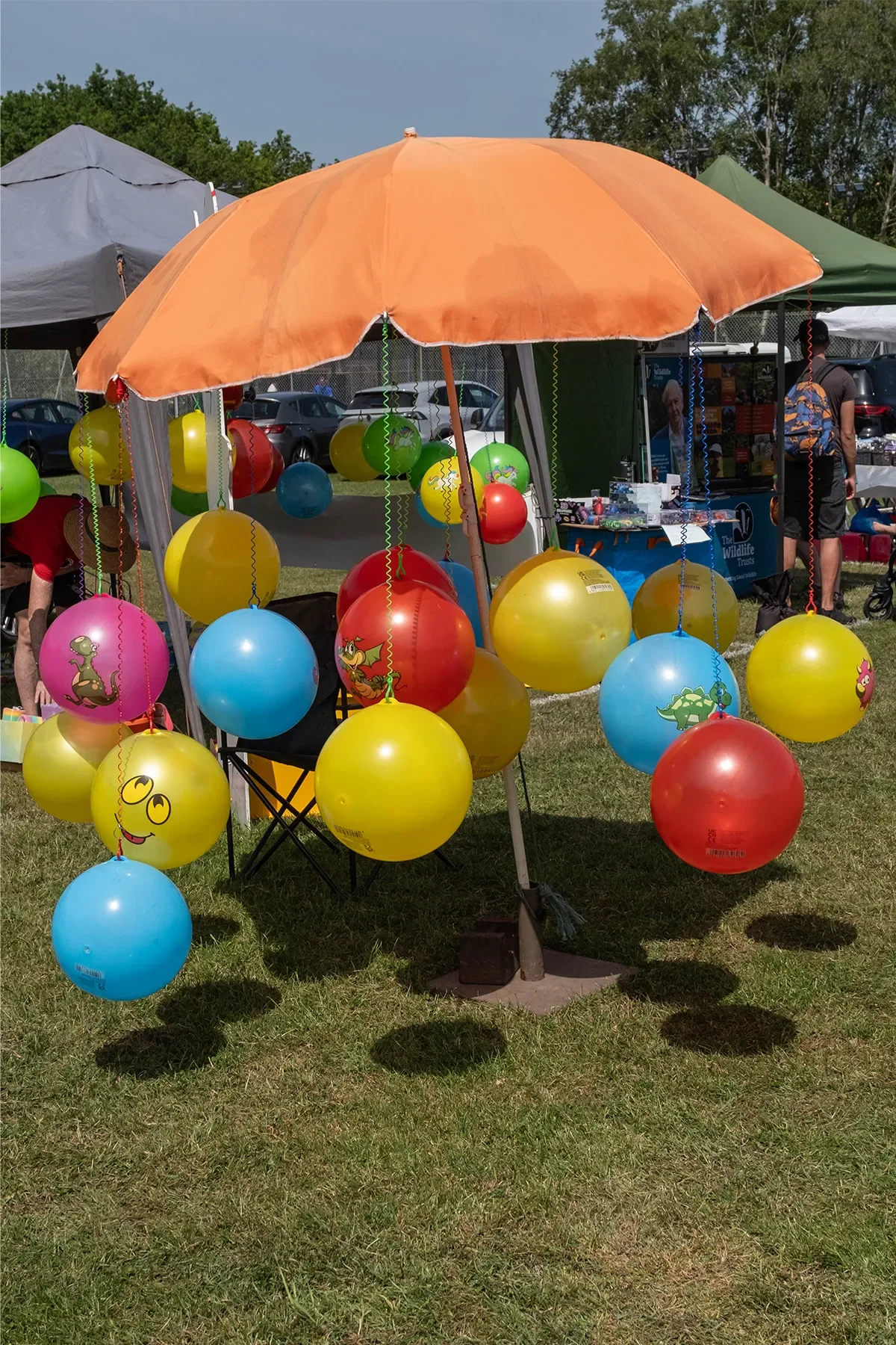 Arkley Village Fayre 2026 colourful balloons under umbrella