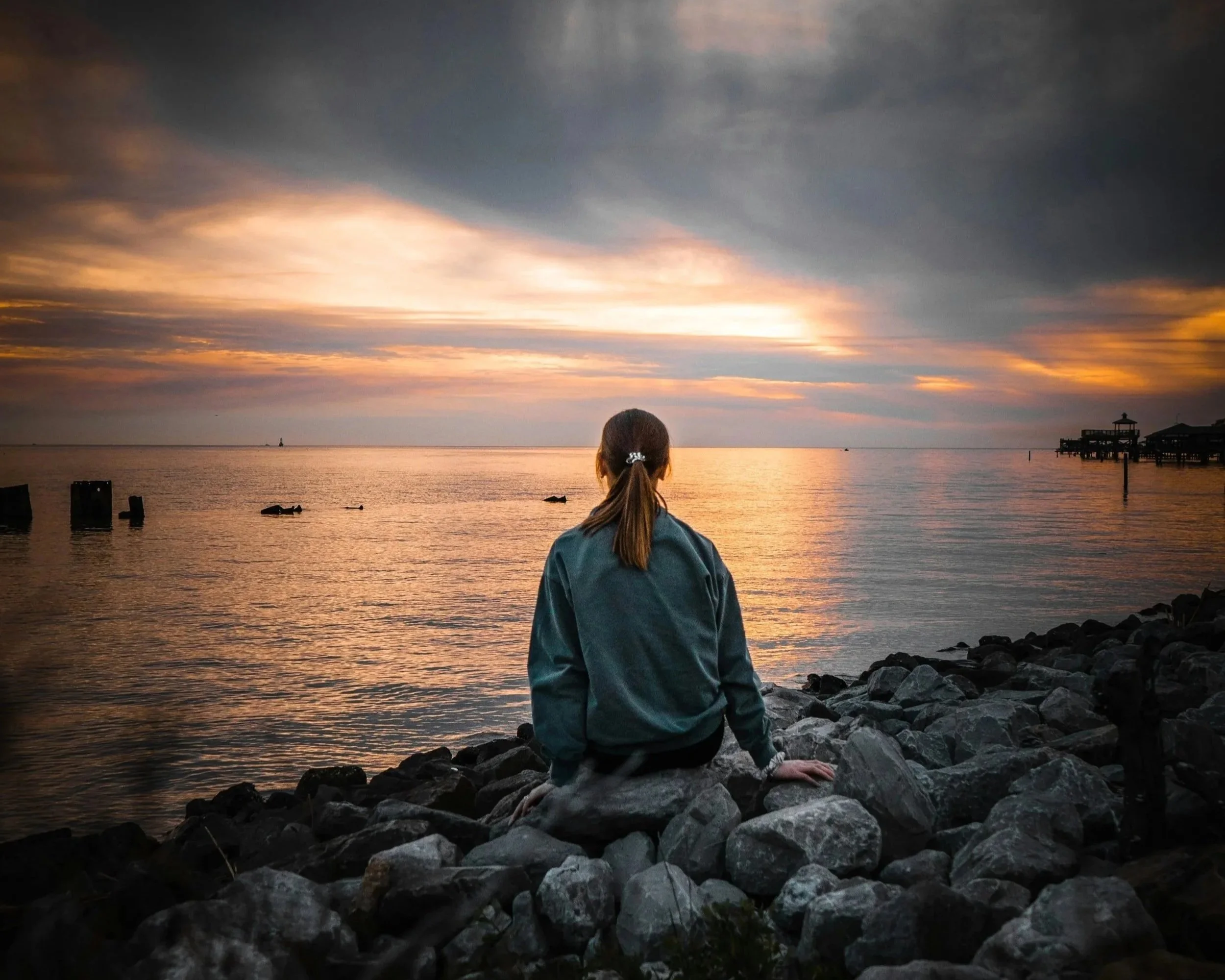 Person practicing a calming Sunday evening transition ritual to ease anticipatory anxiety before Monday