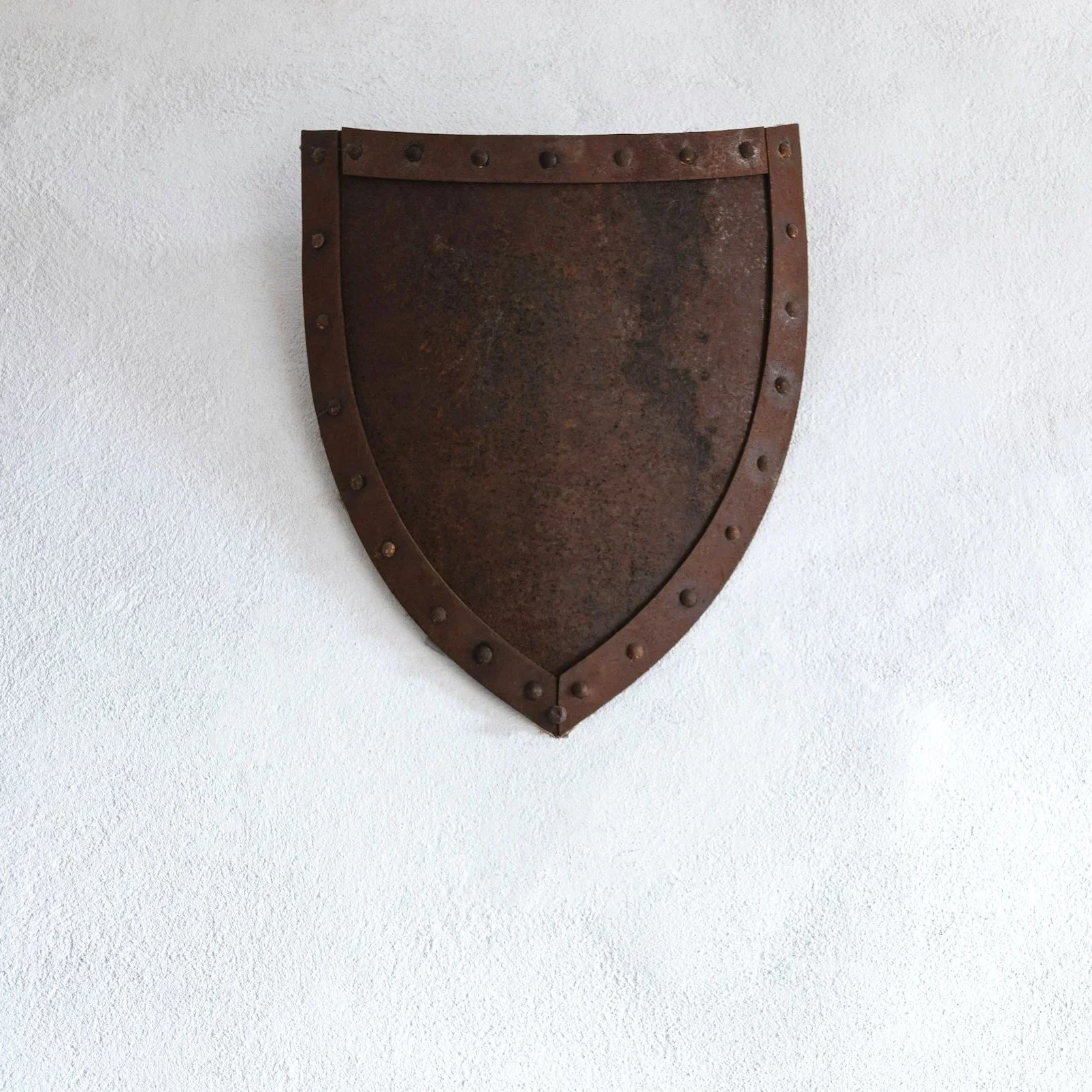Photo of a shield representing the barriers we put up around us so we don't keep getting hurt. Using EMDR Therapy for past trauma can help us put those shields away.