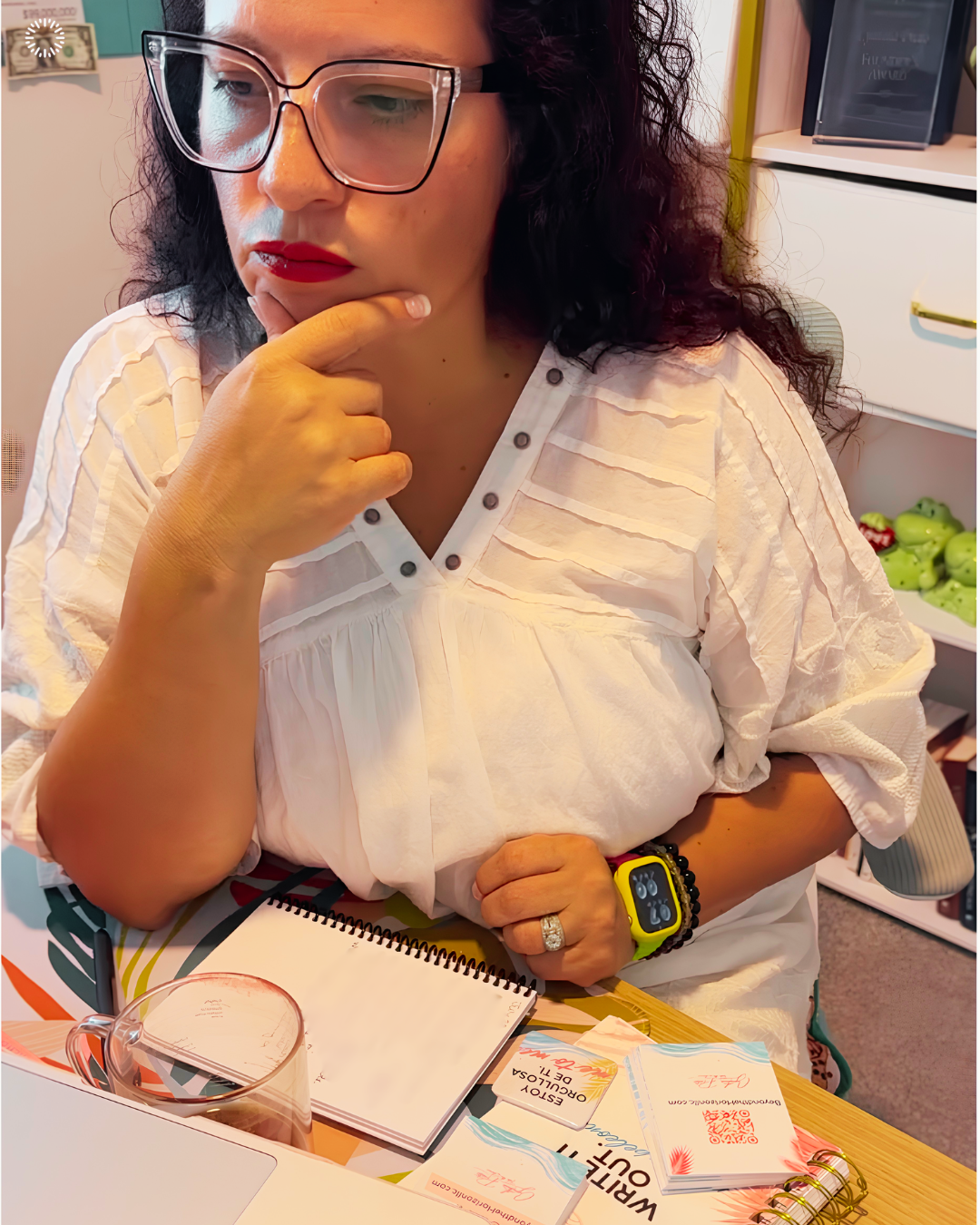 Cynthia Prato thoughtfully planning at her desk while working on Beyond the Horizon Consulting, reflecting on perfectionism, entrepreneurship, and the challenge of feeling ready before taking action.
