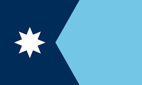 Blue hexagon shape and white eight-point star on dark blue background