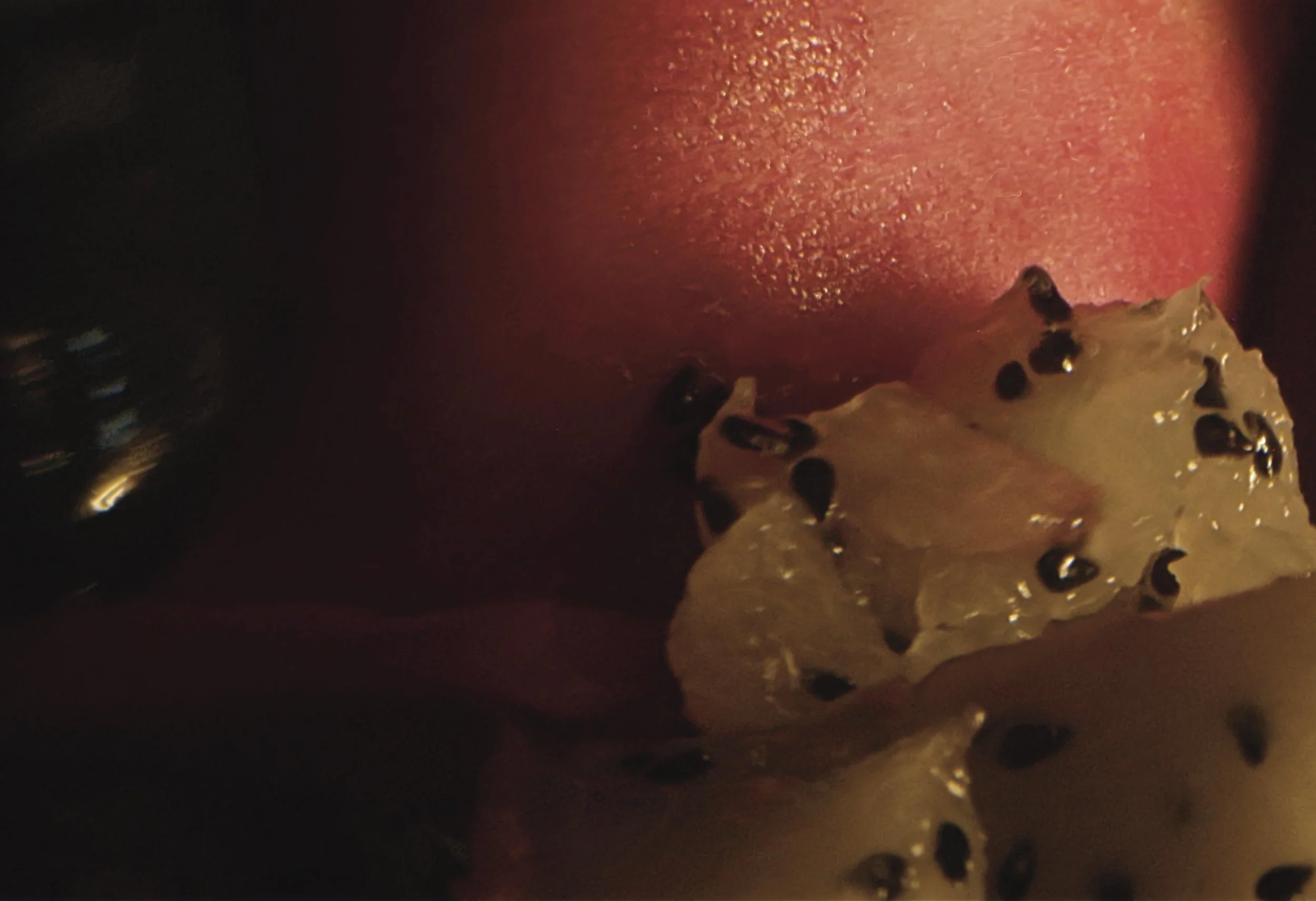 macro video still of dragon fruit being pulled apart, almost abstract