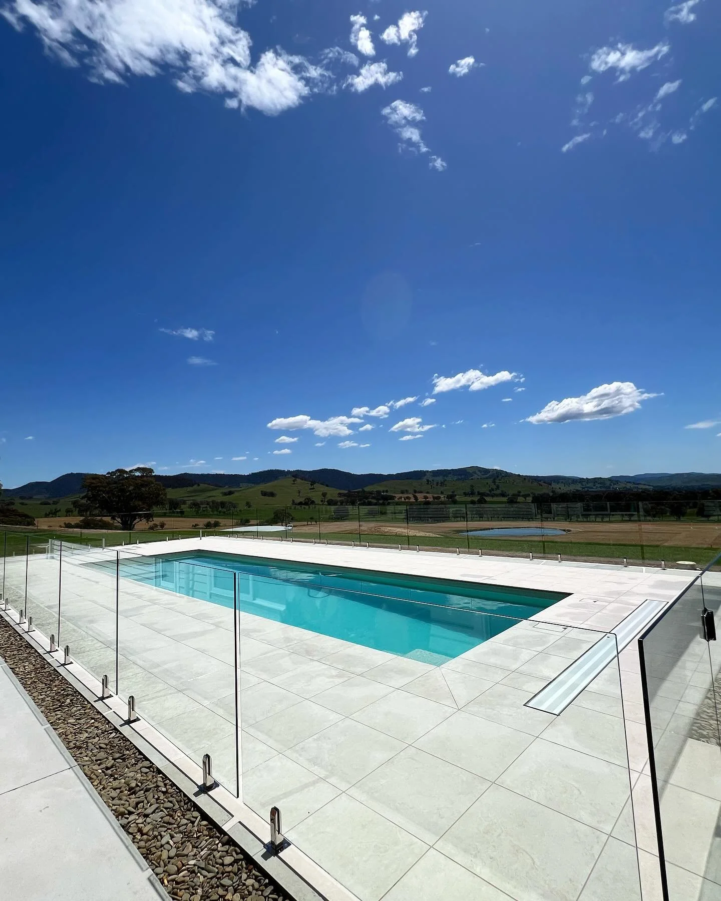 The boys were out in Walwa over the weekend finishing up the glass fencing from the installation of our 12.5m Eden from Conquest Pools. How&rsquo;s that for a view!