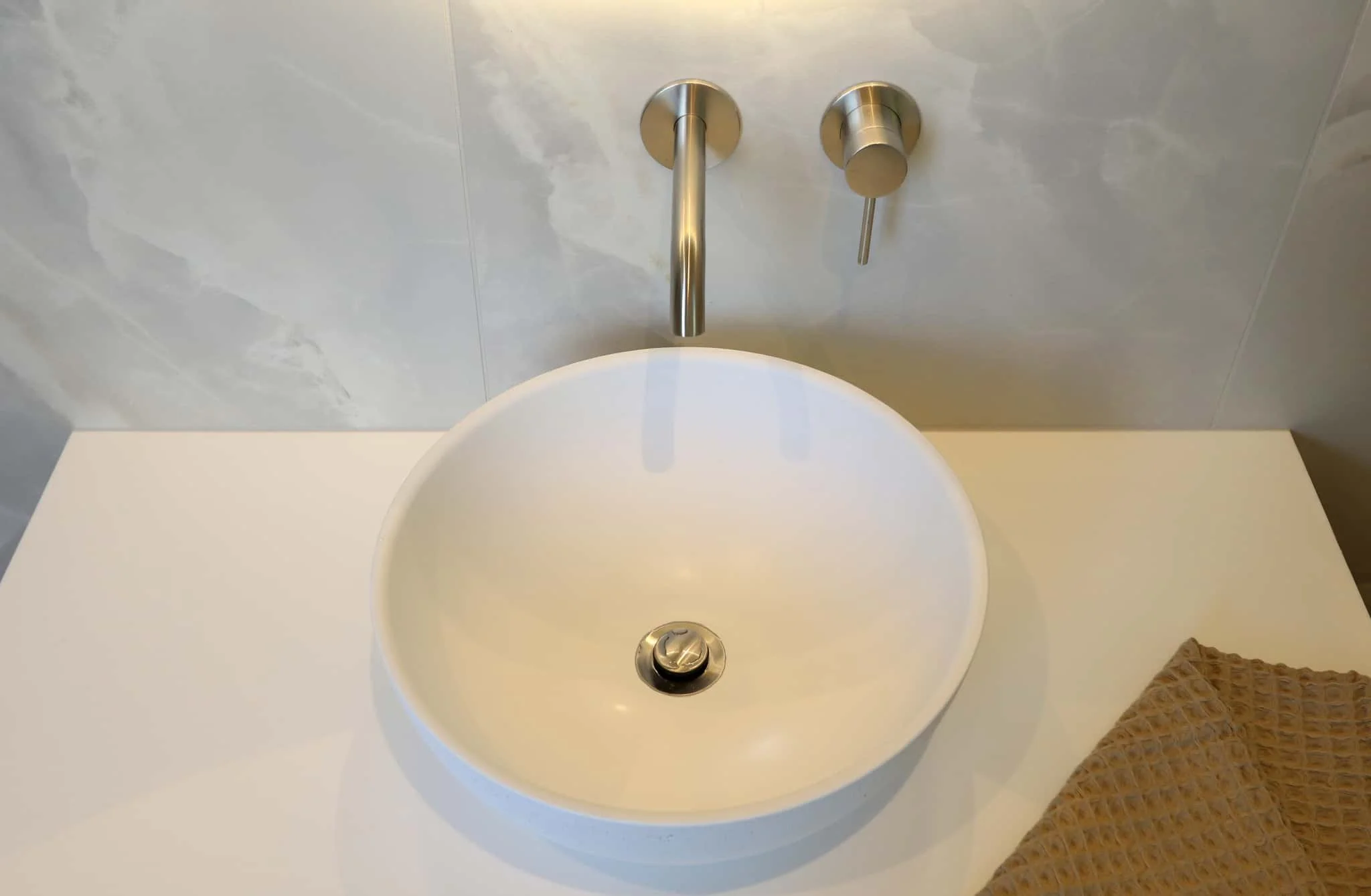 Luxury Strathmore ensuite with reeded glass shower panels, freestanding bath, and double vanity