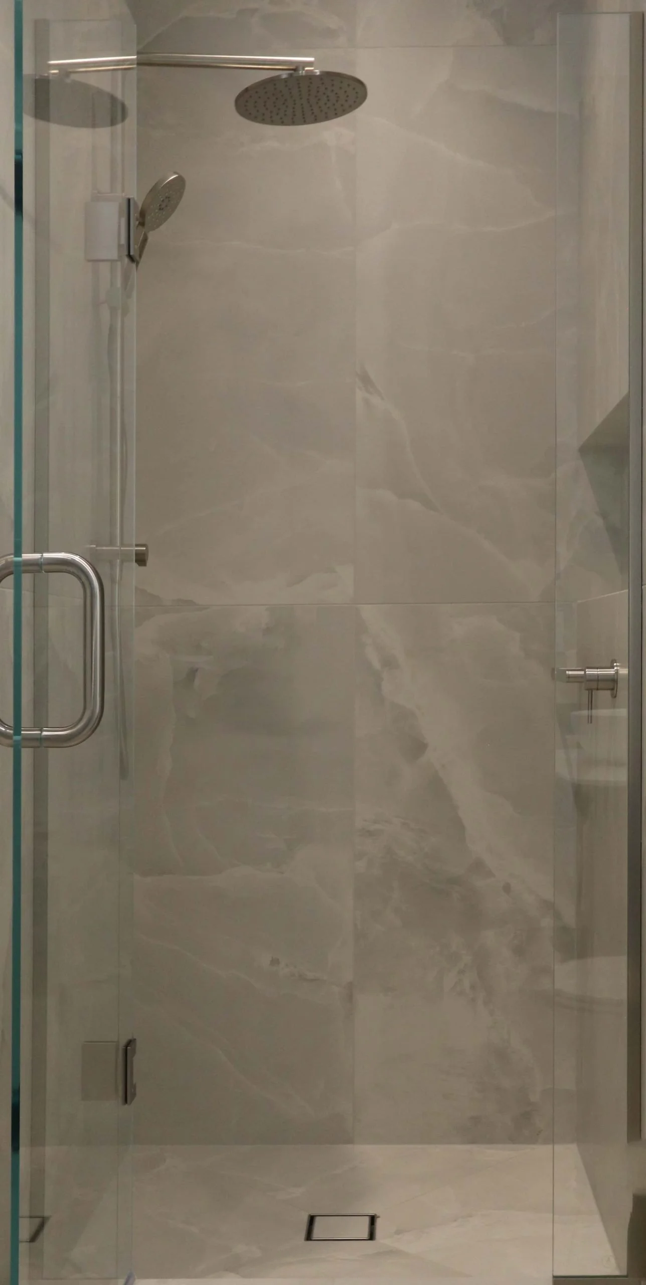 Shower with wall-mounted brushed nickel tapware in a Strathmore 