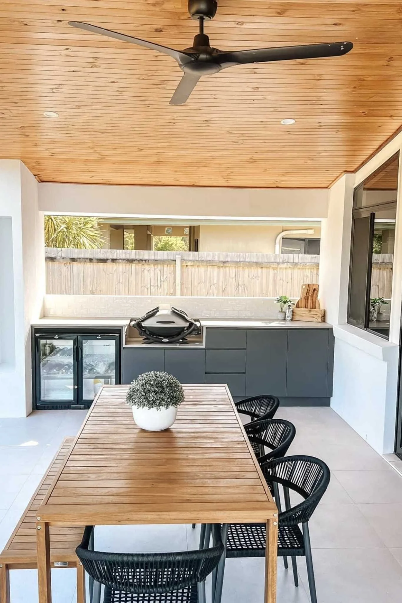 melbourne outdoor living space with built in bbq and decking with outdoor table