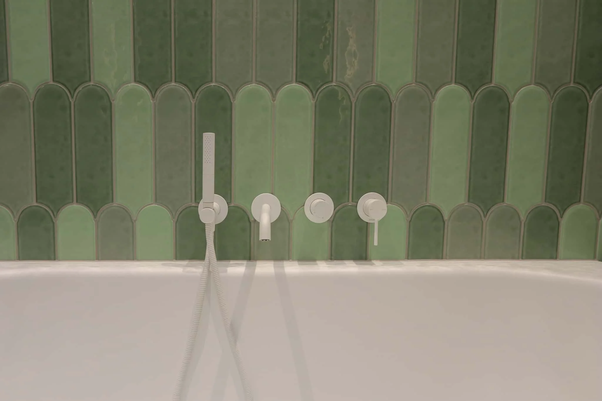 Contemporary Strathmore bathroom renovation featuring dual green basins and matte white wall mixers