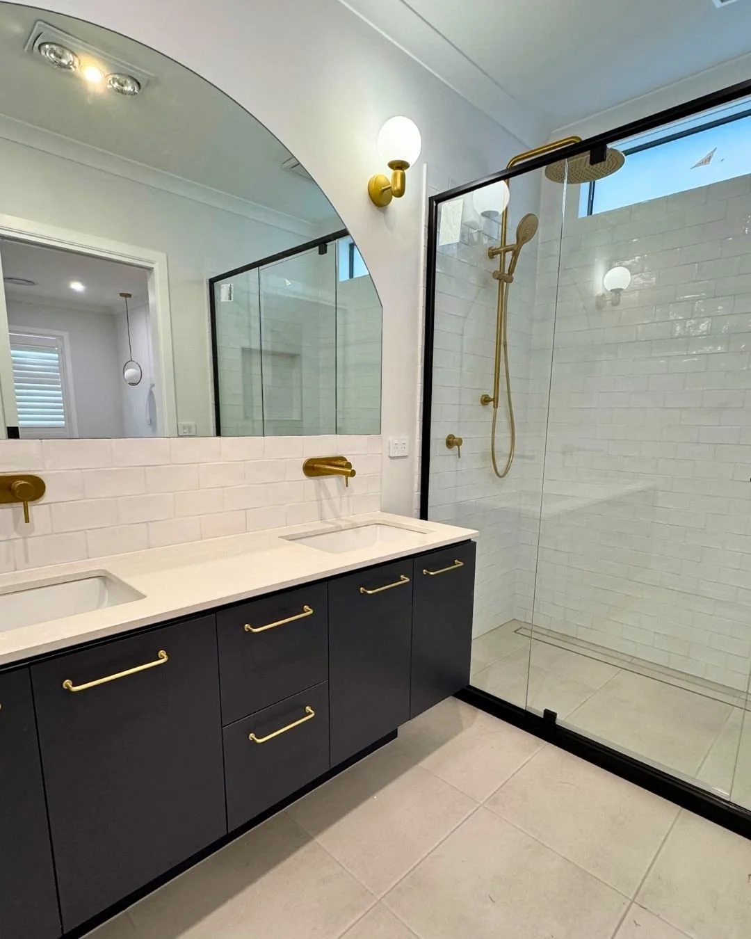 South Melbourne double bathroom renovation with bespoke joinery and modern fixtures