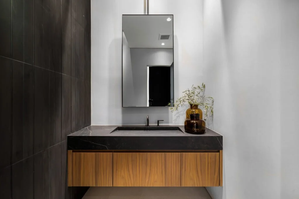 Bathroom renovation in South Yarra with floating timber cabinetry and stone top