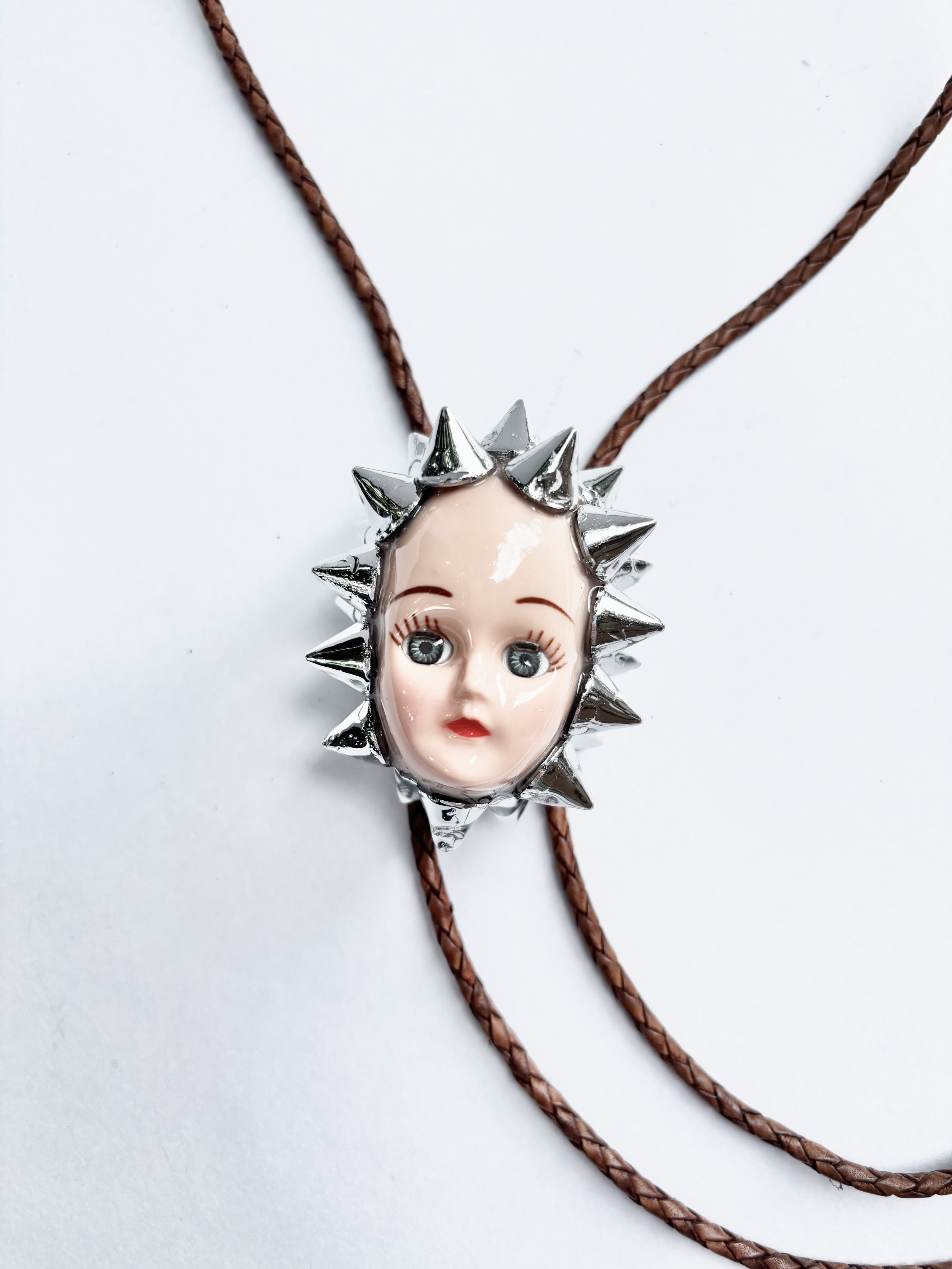 Spiked Doll Head Bolo