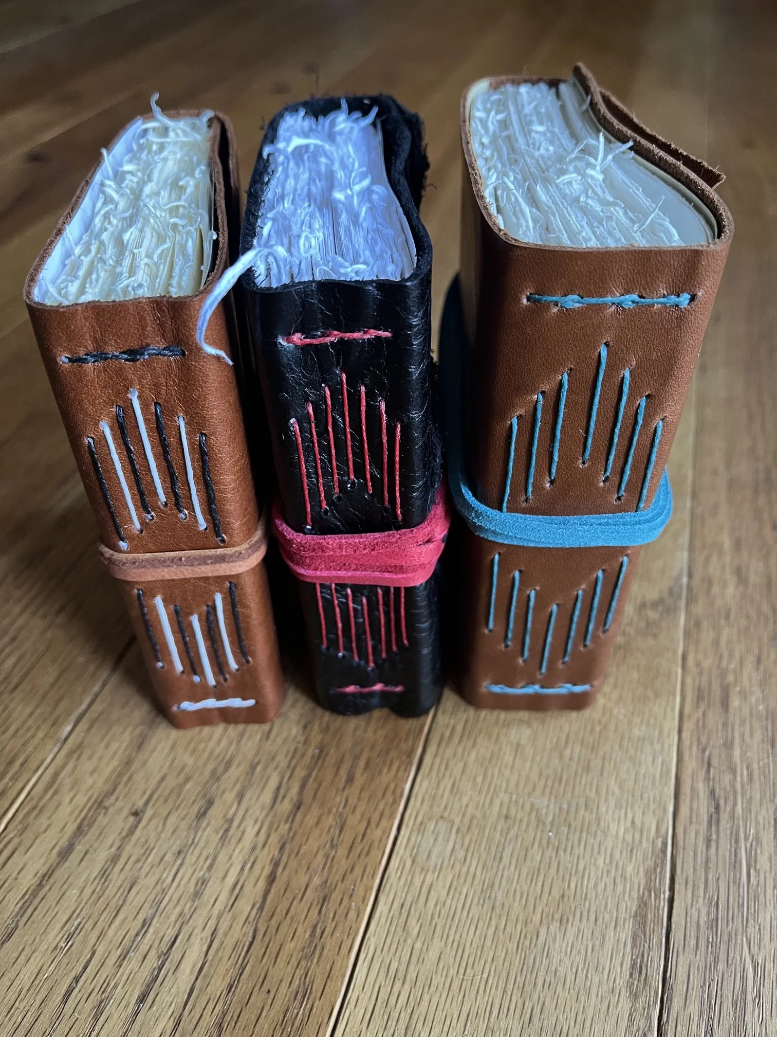 Tiny Leather Longstitch With Handtorn Signatures