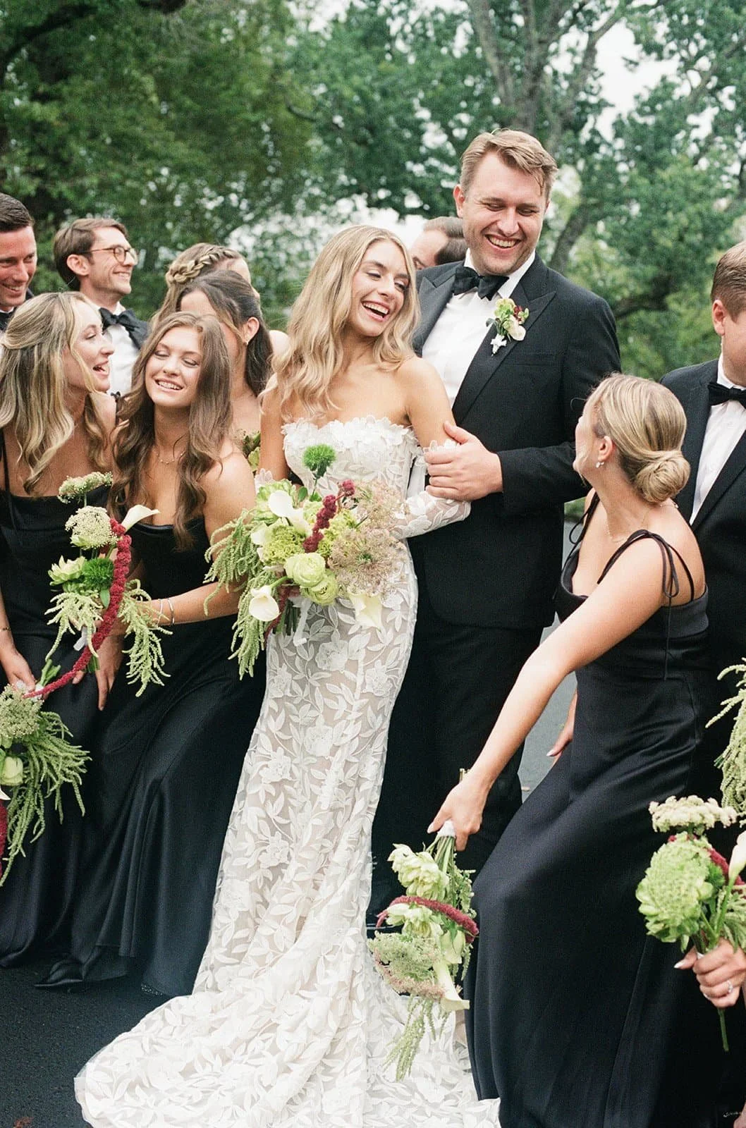 A wedding celebration outdoors with a group of people. Everyone appears joyful at The Clifton Inn in Charlottesville Virginia