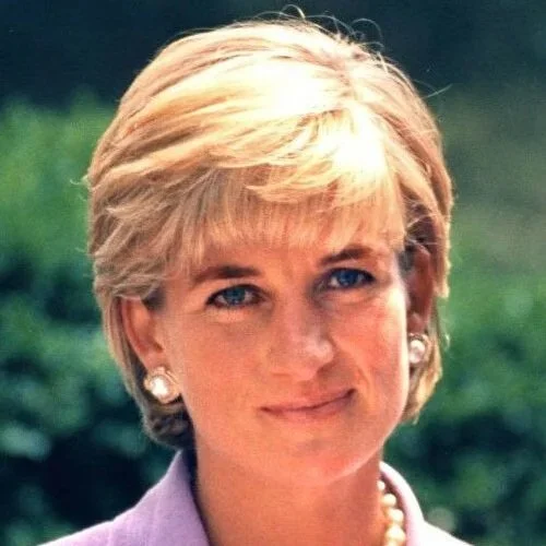 Headshot of Princess Diana in 1997 smiling into the camera.