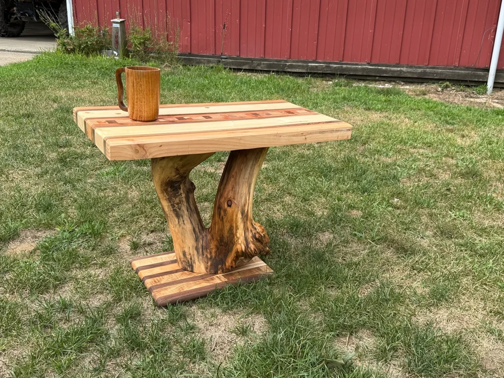 Handcrafted wood table with a natural timber base by Firstborn Mercantile