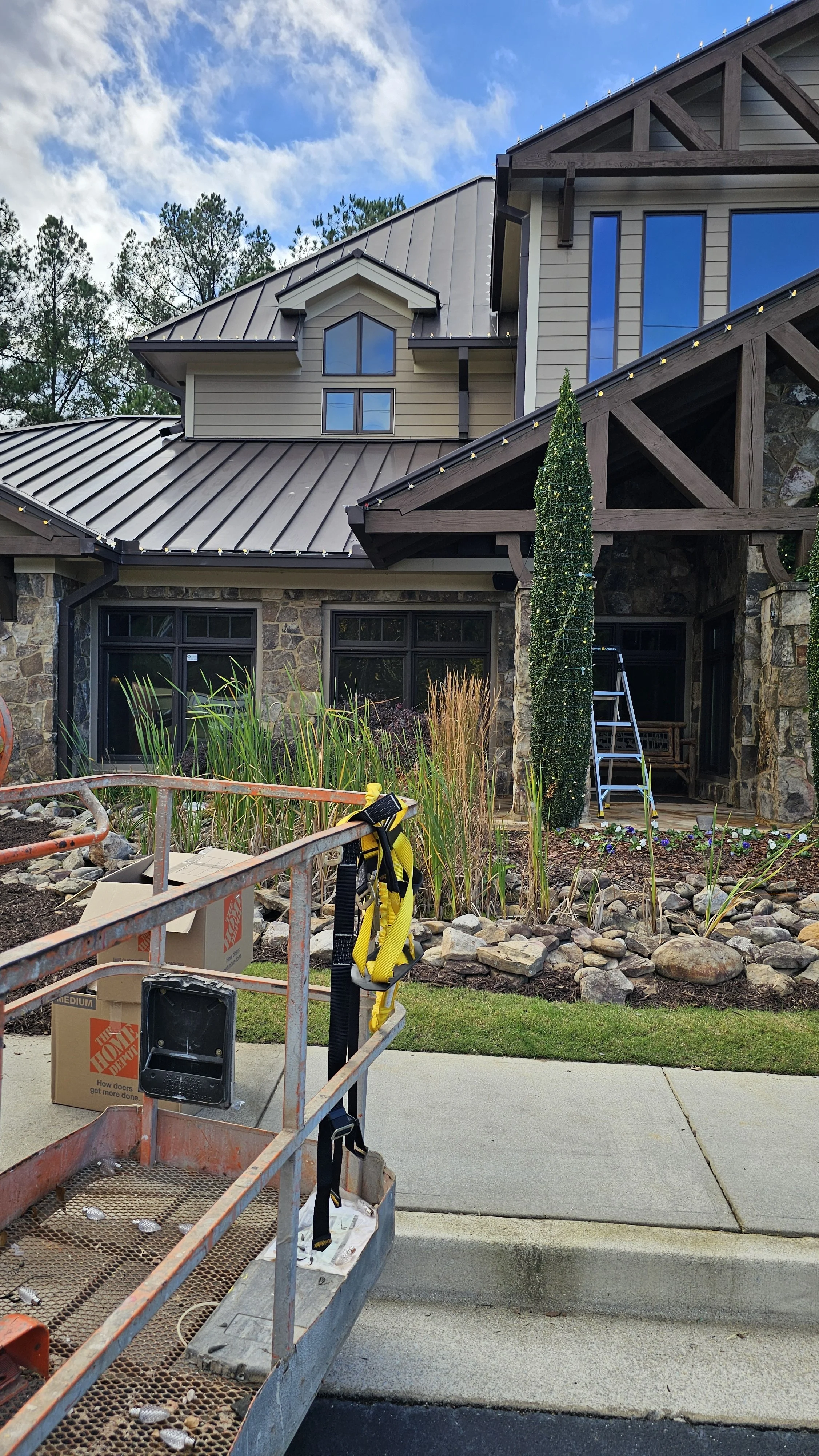 Rich Lighting Co. installing commercial Christmas lights at Depew Orthodontics Acworth GA.jpg
