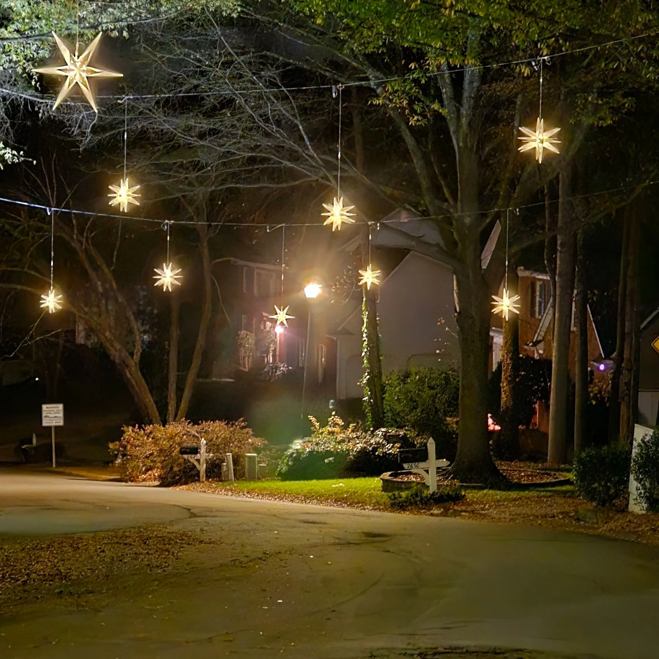 Hanging Christmas stars in Edgewater HOA community in Lawrenceville GA