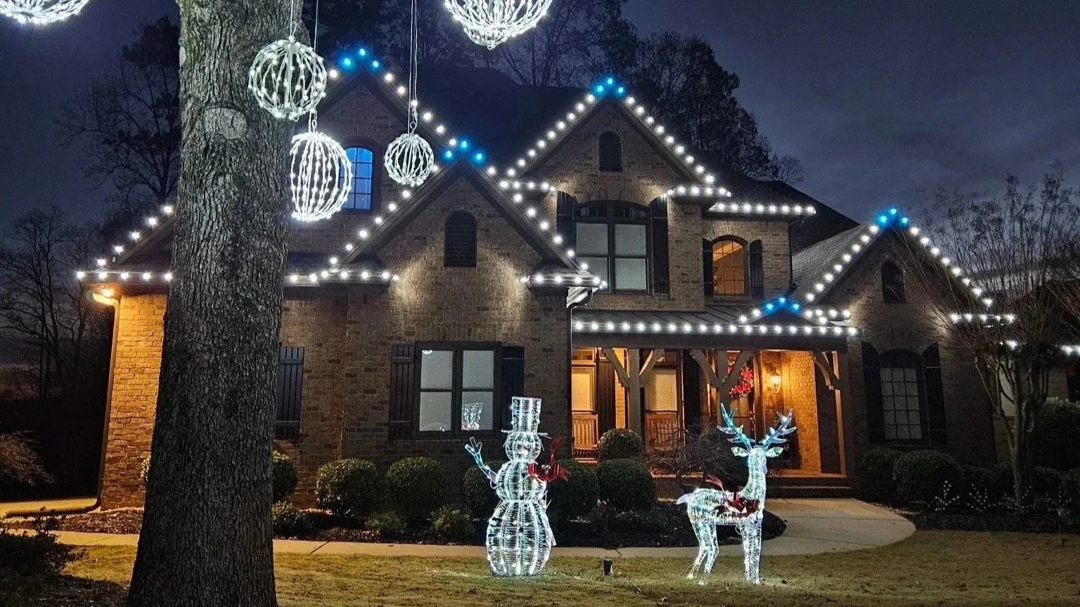 Cool white and aqua residential Christamas light installation Vinings Estates