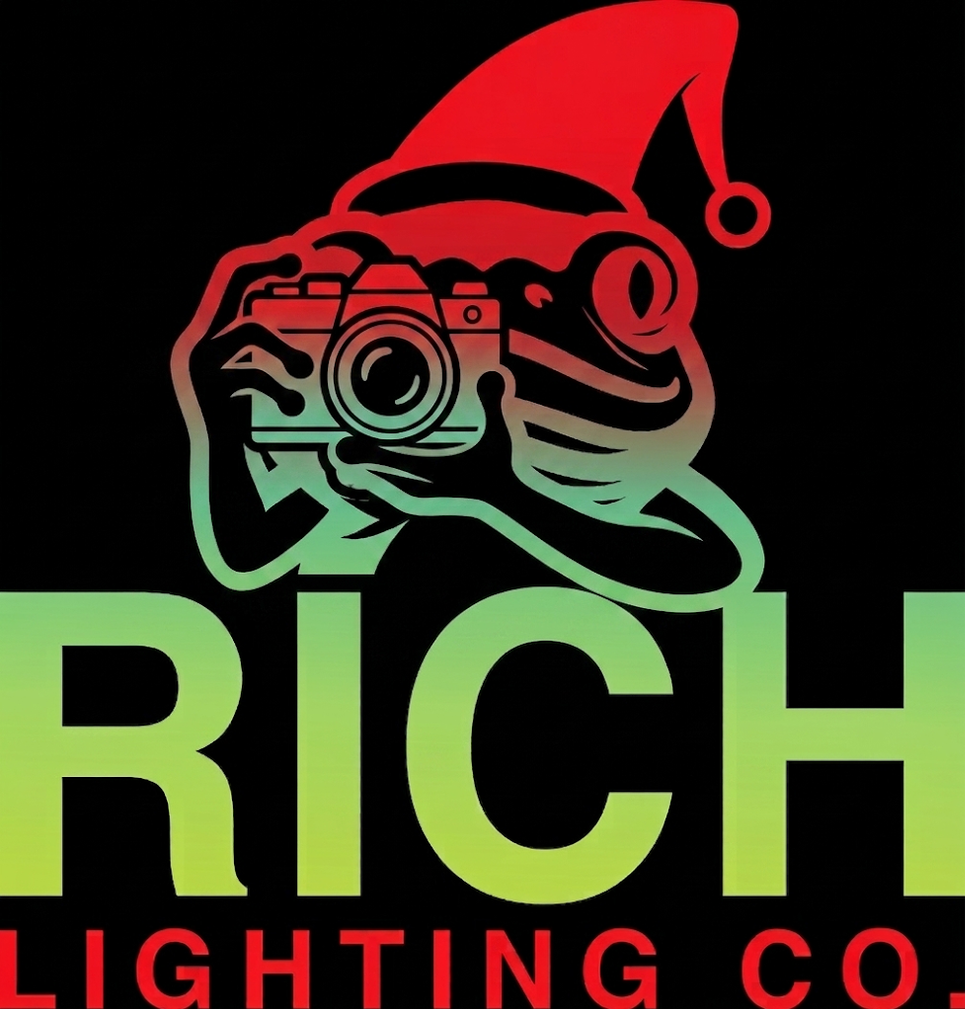 A logo featuring a frog wearing a Santa hat and holding a camera, with the text 'RICH LIGHTING CO' in green and red letters.