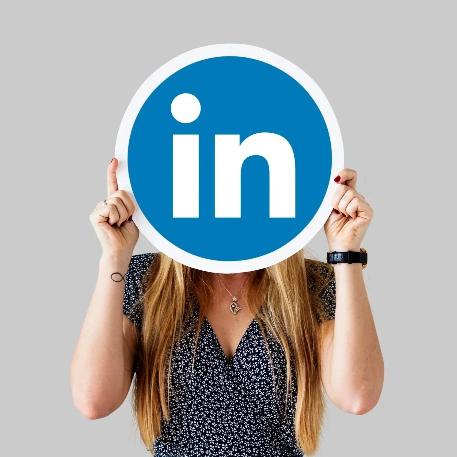 woman-holding-linkedin-icon.jpg
