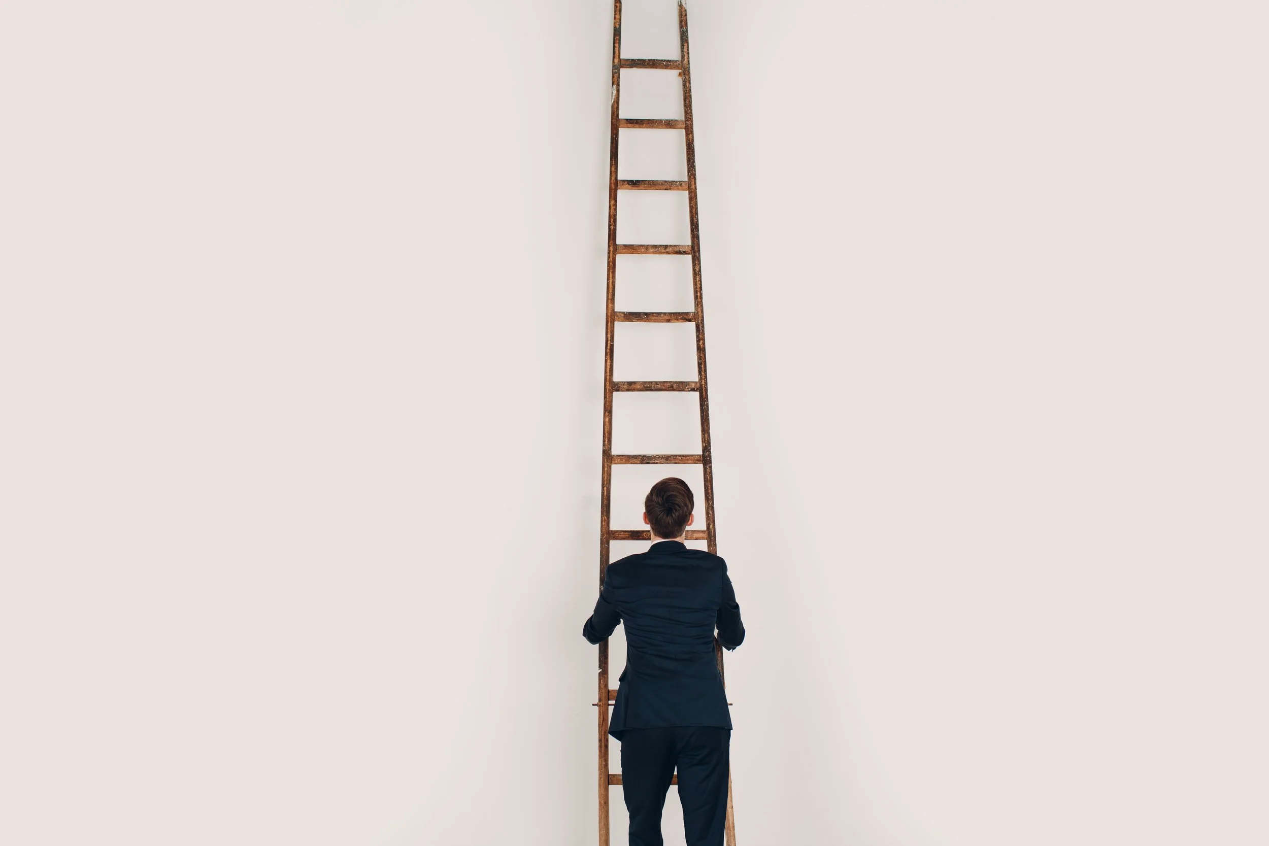businessman-in-black-suit-lift-up-the-stair-caree-2026-01-06-00-53-02-utc.jpg
