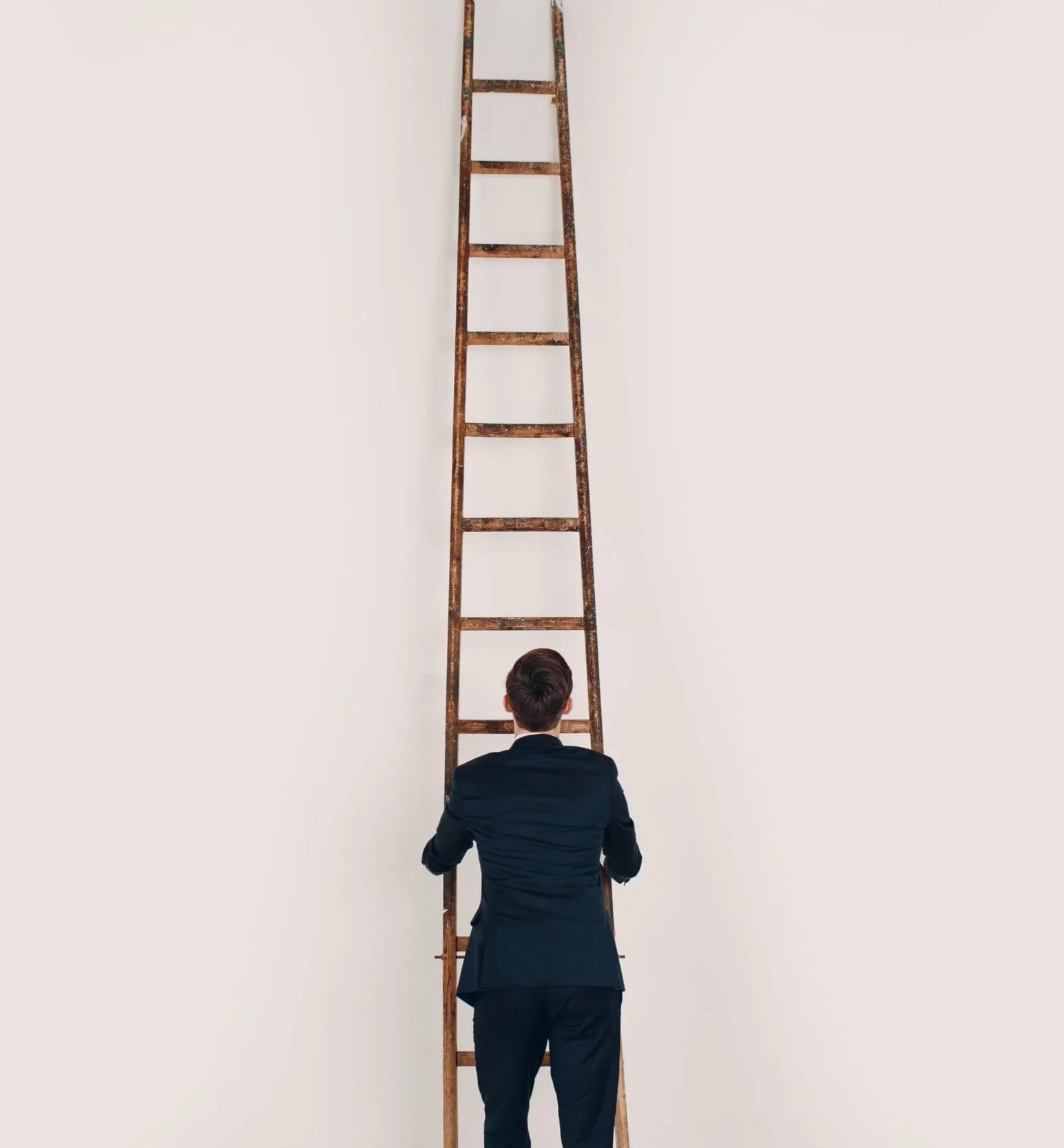 businessman-in-black-suit-lift-up-the-stair-caree-2026-01-06-00-53-02-utc.jpg
