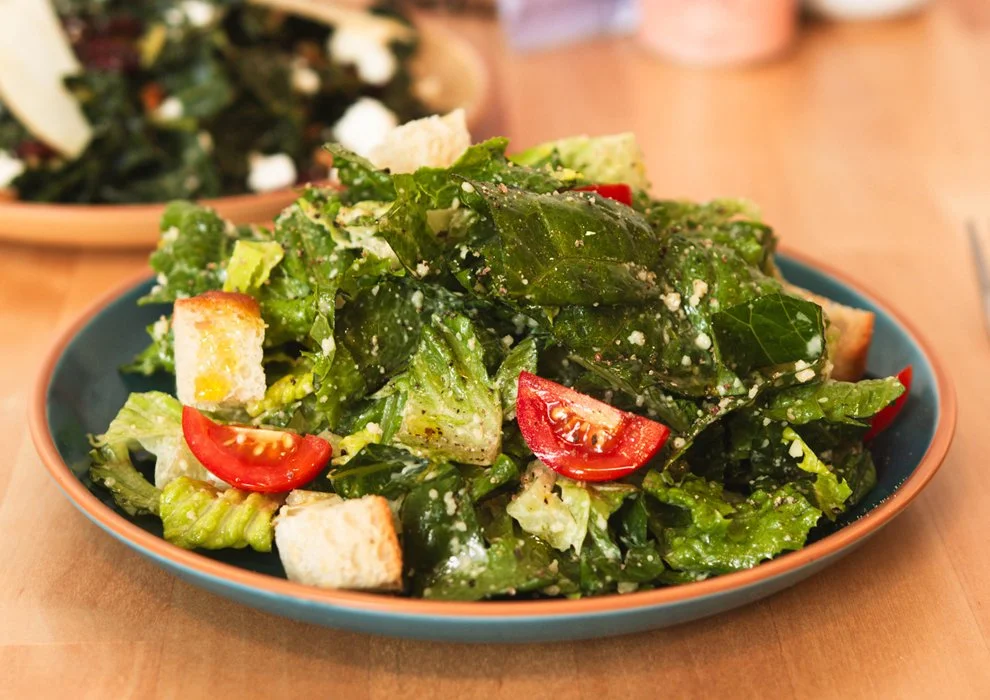 Caesar Salad. Romaine, cherry tomatoes, parmesan, croutons, with house-made caesar dressing.