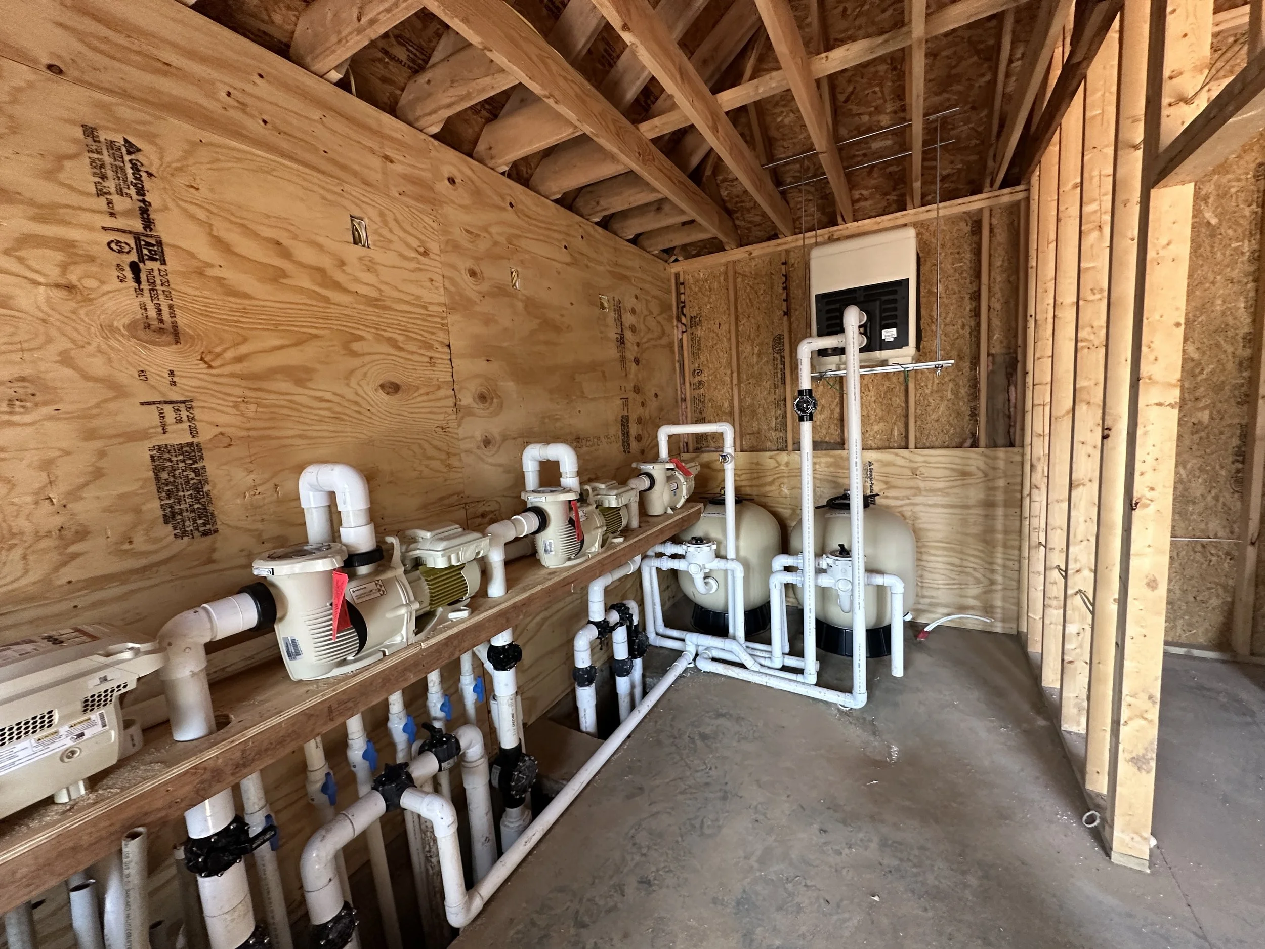 An image of the Tesla Pool pump room.