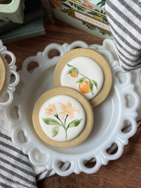 Orange and Orange Blossom Cookies on Plates.png
