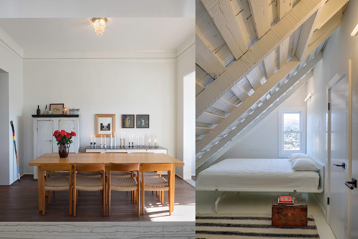 Dining area with simple wooden table and chairs, and adjacent white-washed attic bedroom with city view window in Bernal Heights cottage.