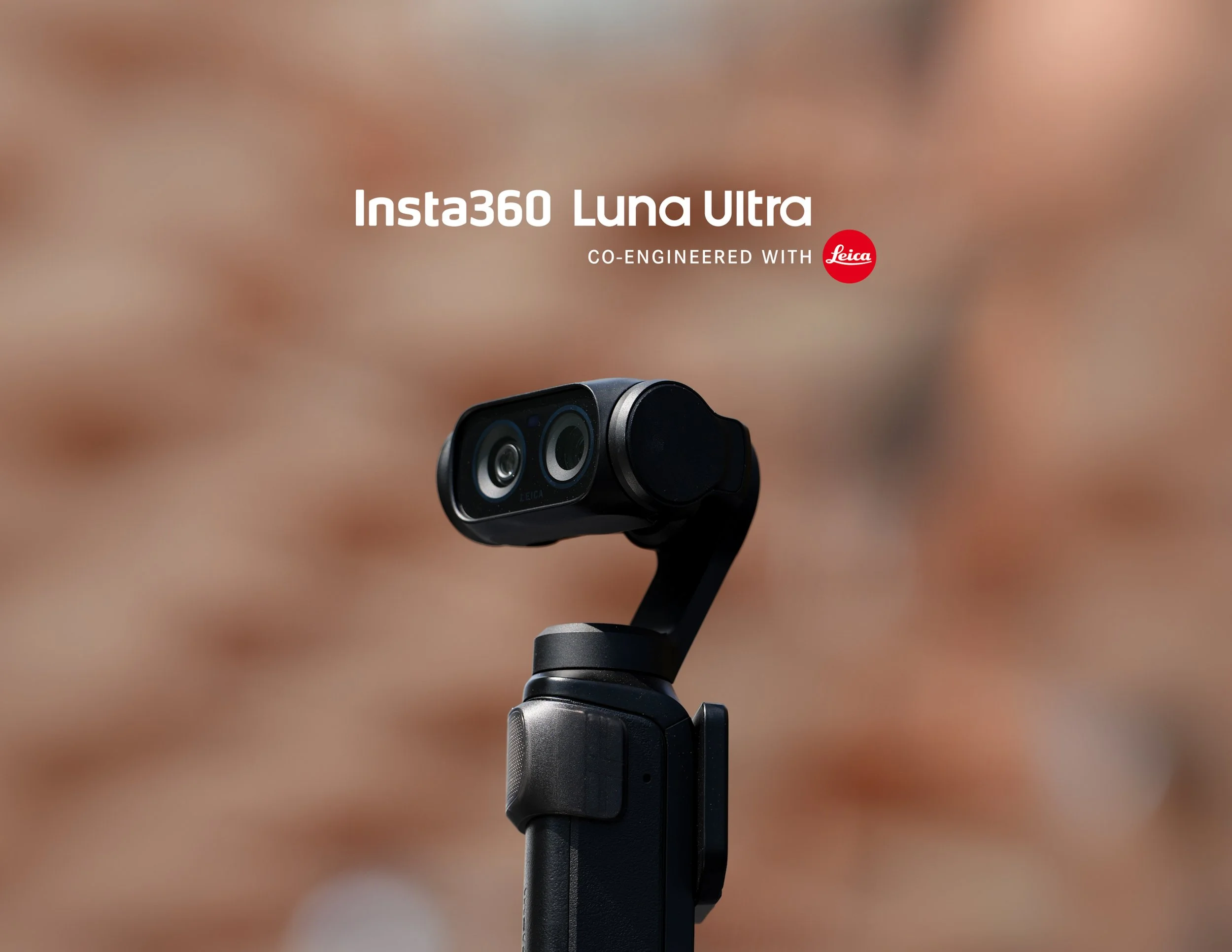 Close-up of a camera mounted on a gimbal against a blurred background.