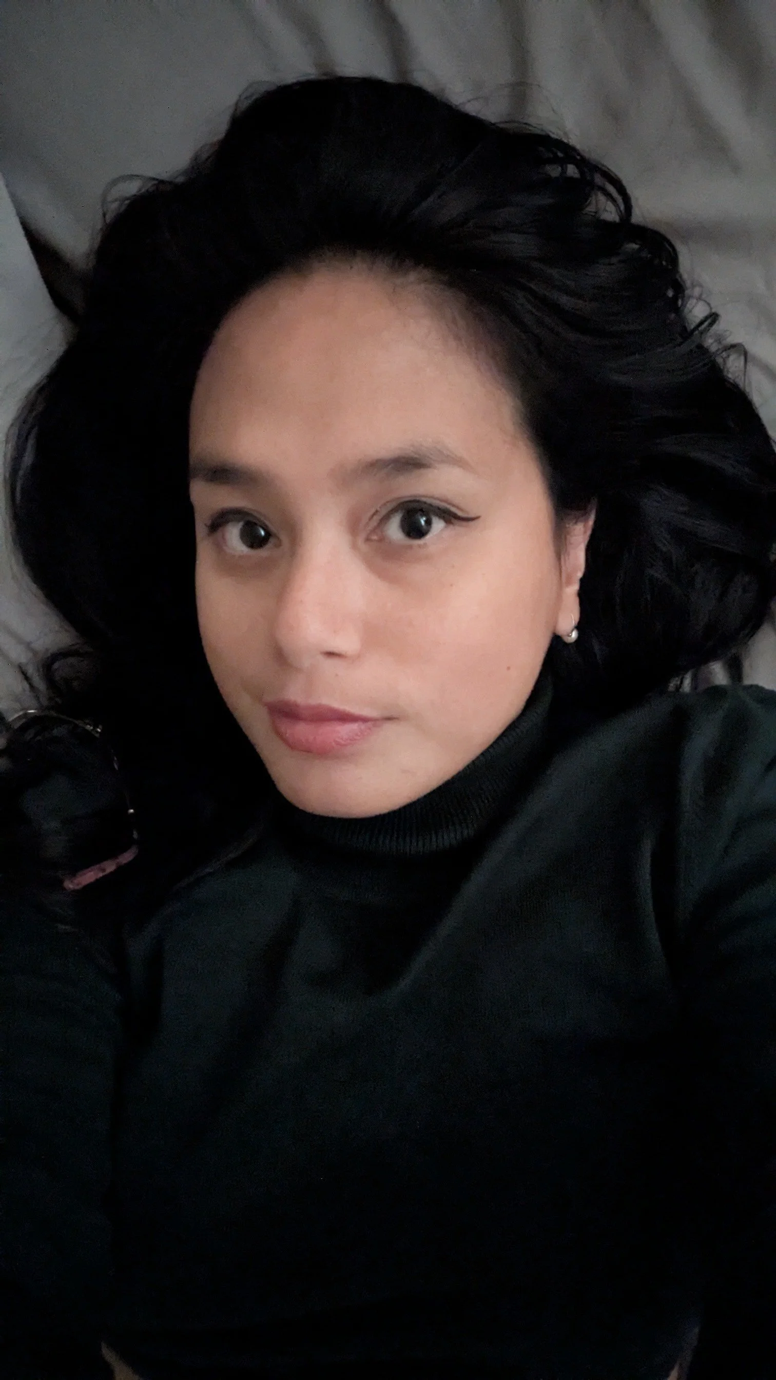 Portrait of Geralyn 'Gigi' Anderson, an Asian-Australian woman with dark hair, dark eyes and tan complexion.