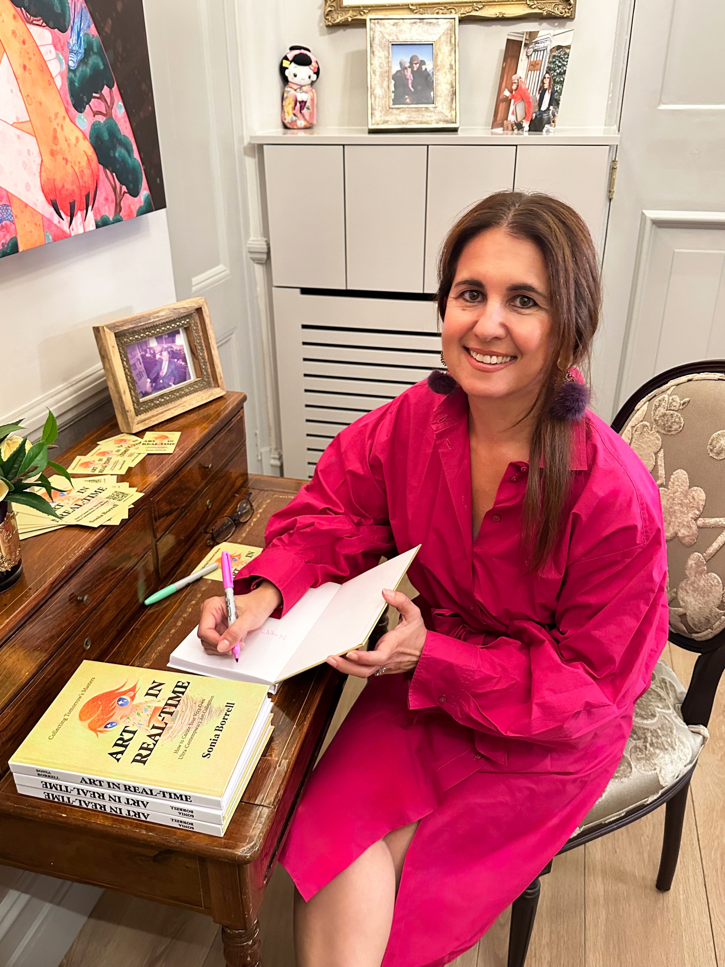 Sonia Signing Book.jpeg