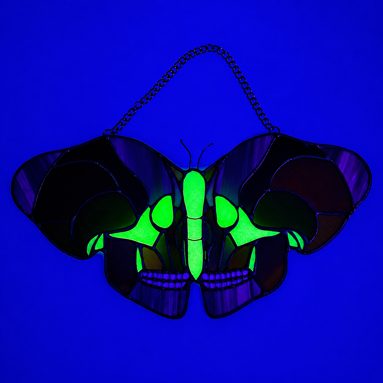 Skull moth stained glass in glow in the dark bright greens