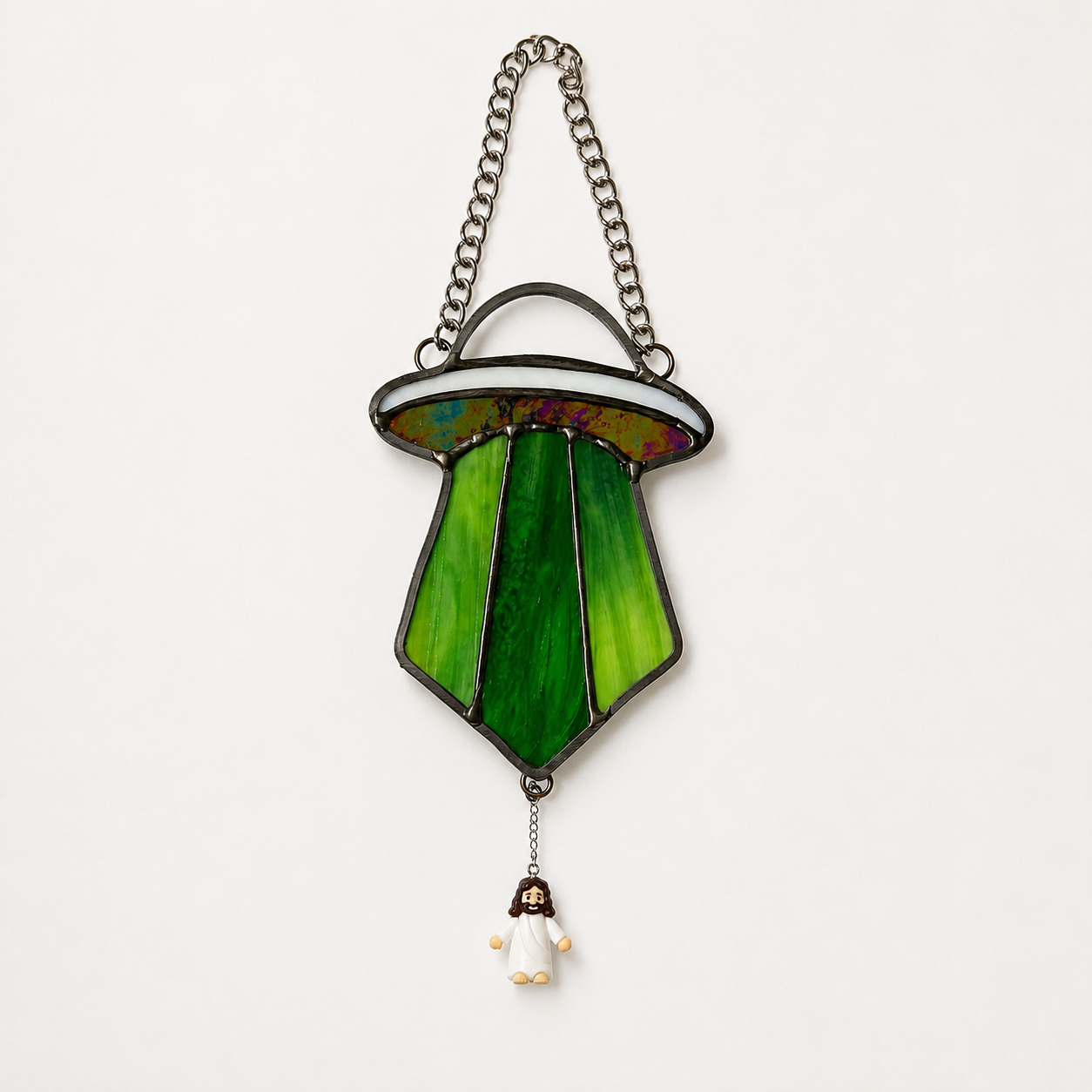 UFO ornament abducting a jesus figure