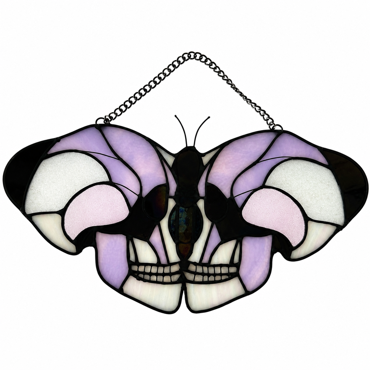 Skull moth stained glass in pink and white with iridescent black, backlit