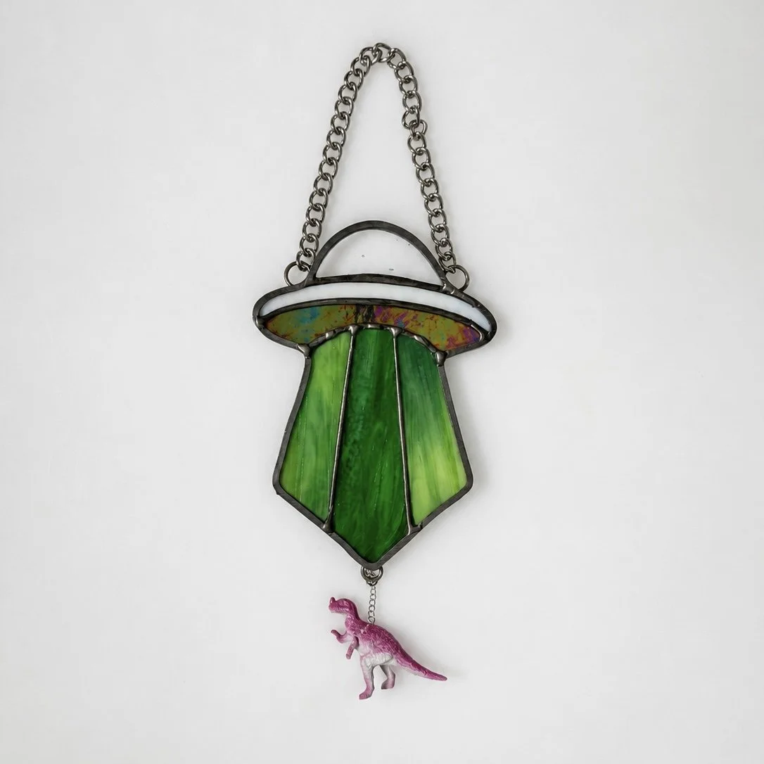UFO Ornament abducting a dinosaur