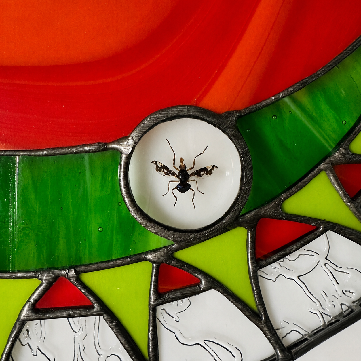 venus flytrap stained glass half circle featuring a preserved picture-winged fly