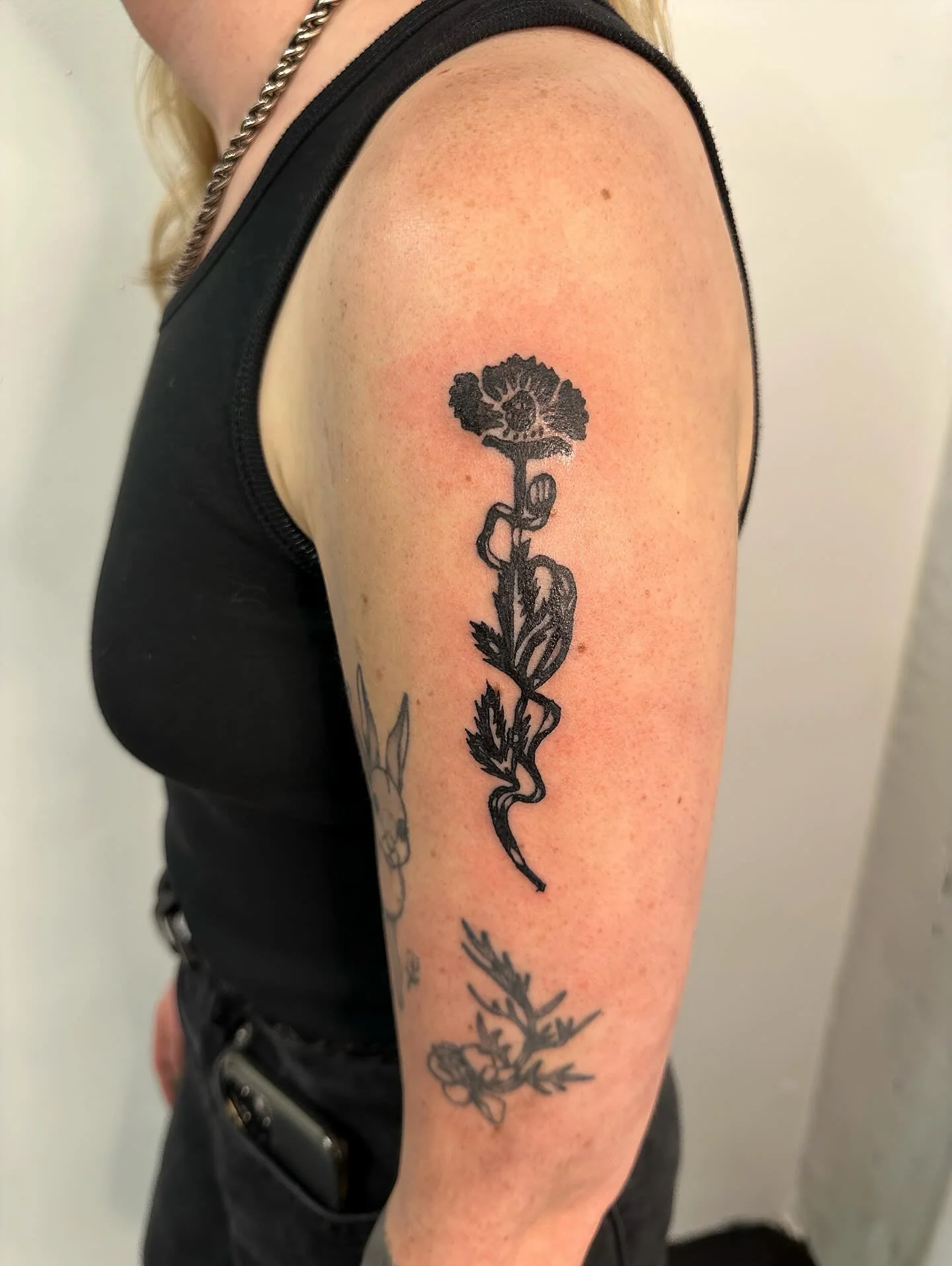 🖤🌸 by @saintshivs 

This dark richly inked carnation has us thinking of our Queen, Persephone, who is currently spending time in the underworld🌌

Shivs focuses primarily on black and grey neotraditional, cybersigilism, text, and a bit of fine line